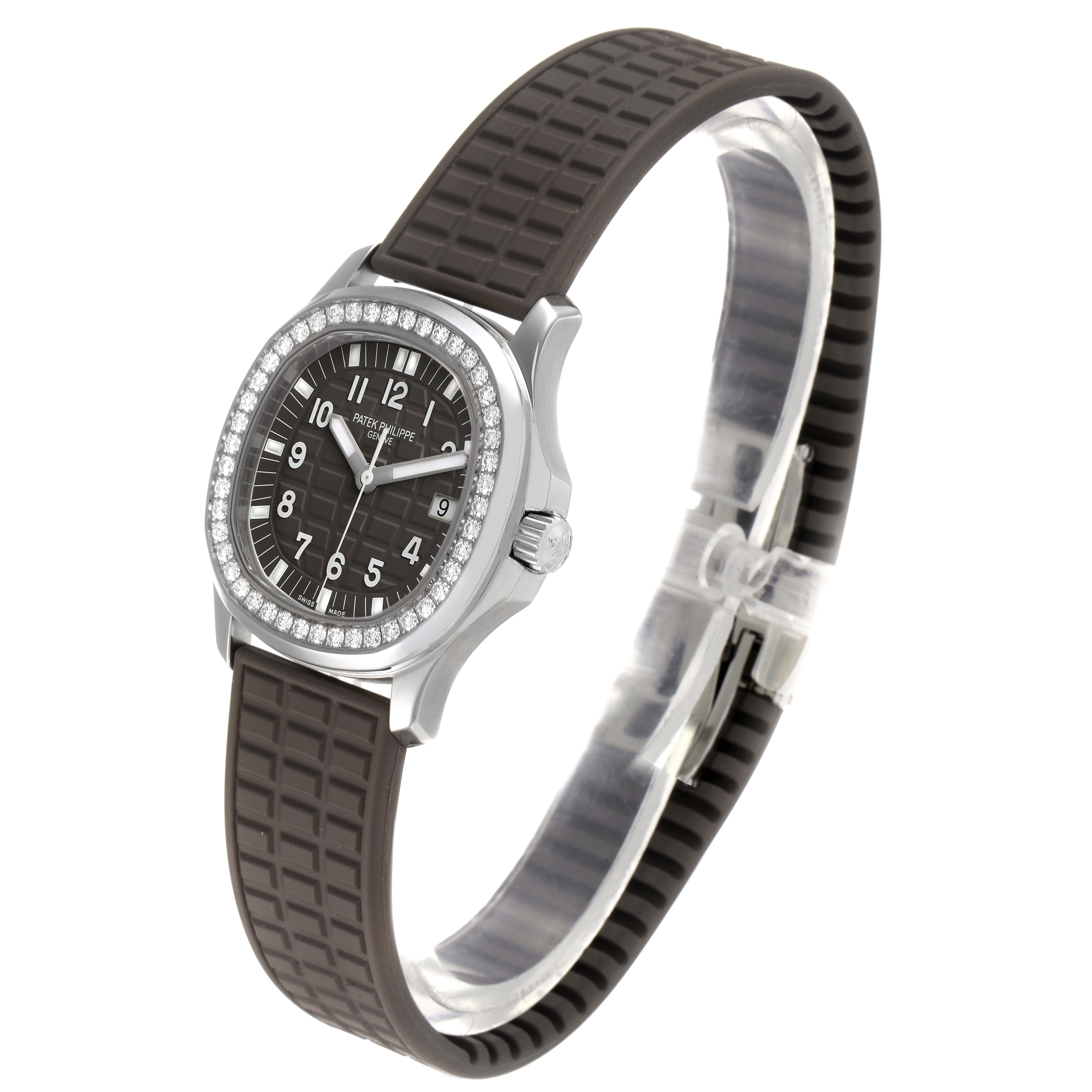 The image shows a side and front angle of the Patek Philippe Aquanaut 5067A-023 Women's Stainless Steel Brown Dial 5067A-023 Women's Stainless Steel Brown Dial watch, highlighting its rubber strap, diamond-set bezel, and dial.