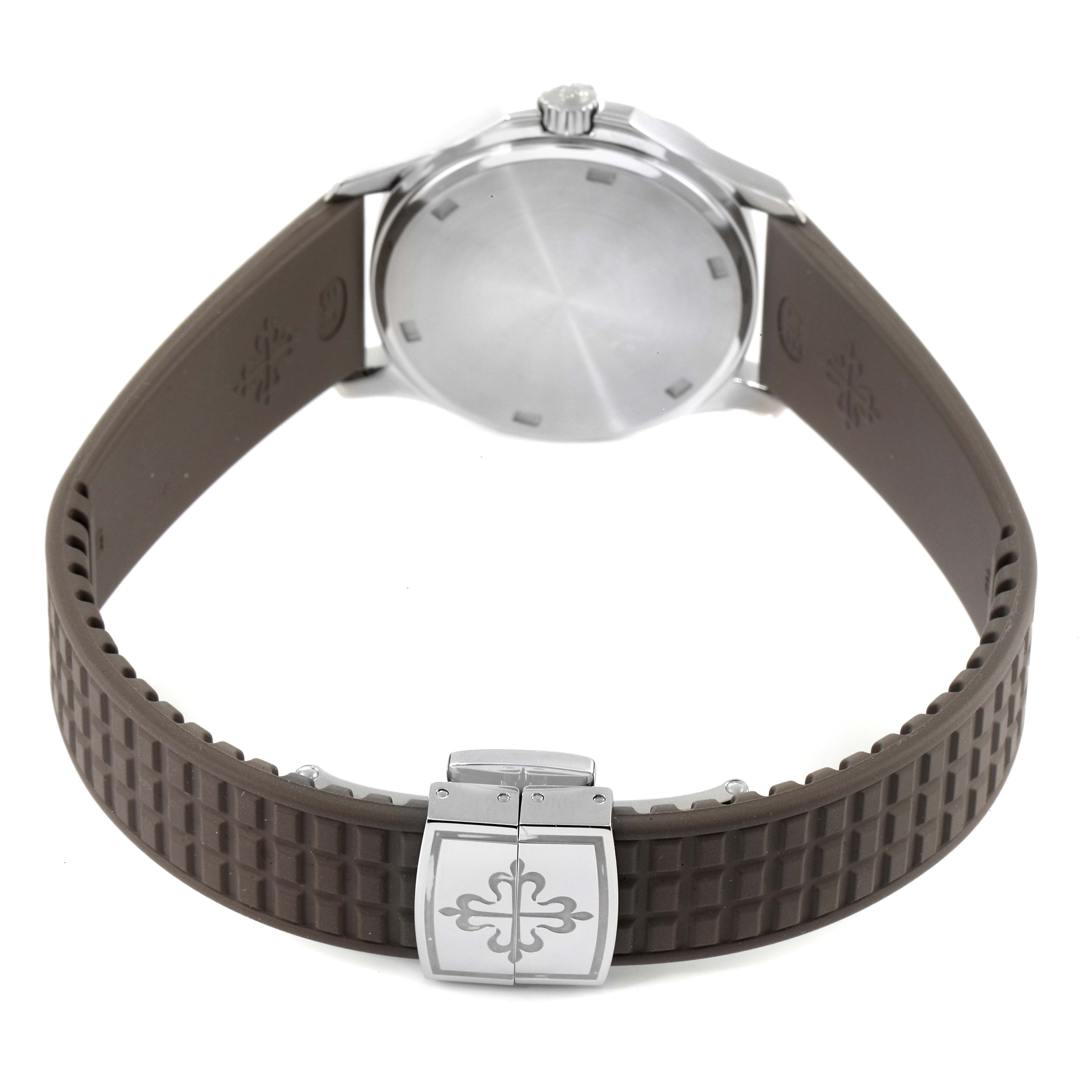 The image shows the back view of a Patek Philippe Aquanaut 5067A-023 Women's Stainless Steel Brown Dial 5067A-023 Women's Stainless Steel Brown Dial model, highlighting the case back and rubber strap with clasp.