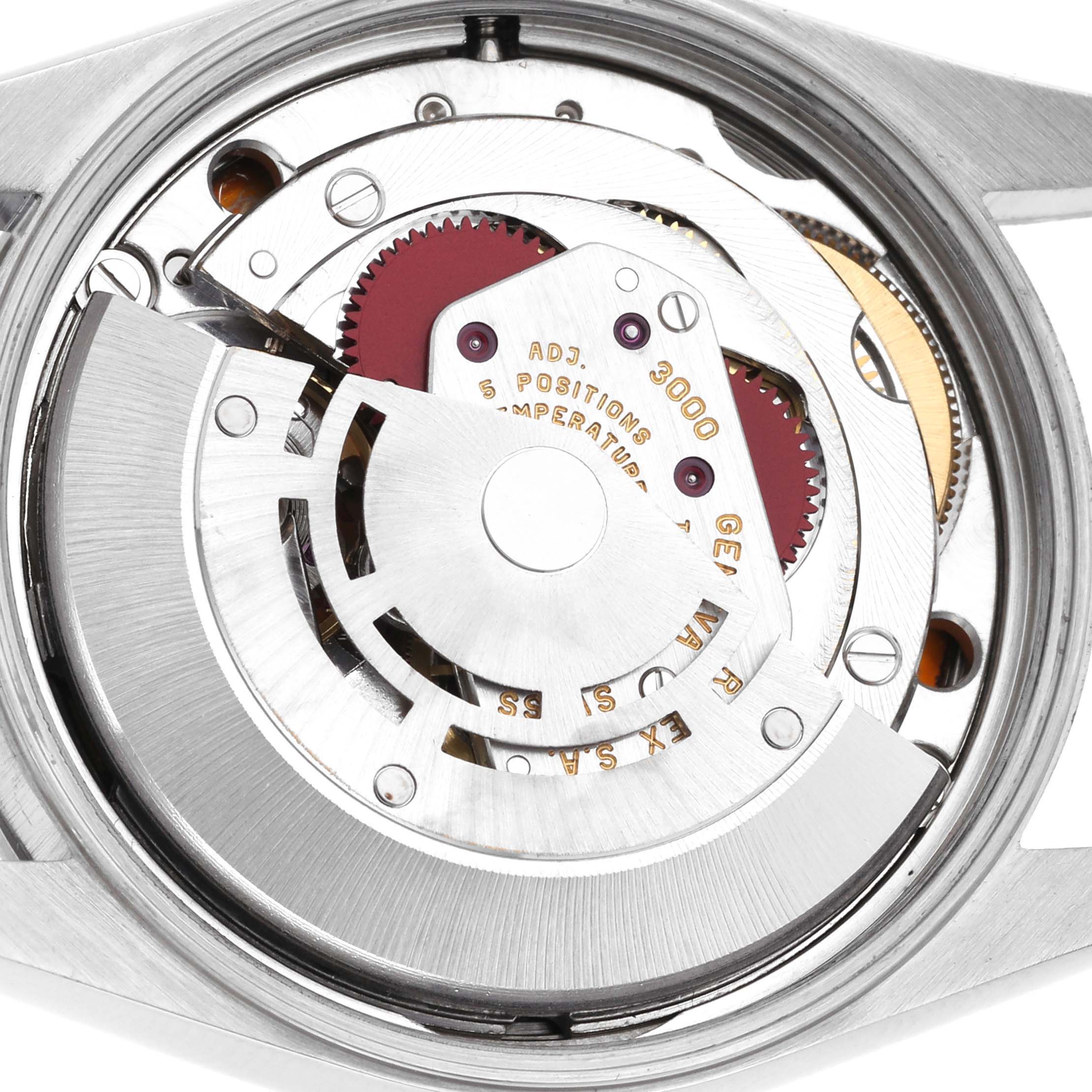 The image shows the movement of a Rolex Air-King 14000 Men's Stainless Steel Blue Dial 14000 Men's Stainless Steel Blue Dial watch from the case back view, highlighting gears and inscriptions.