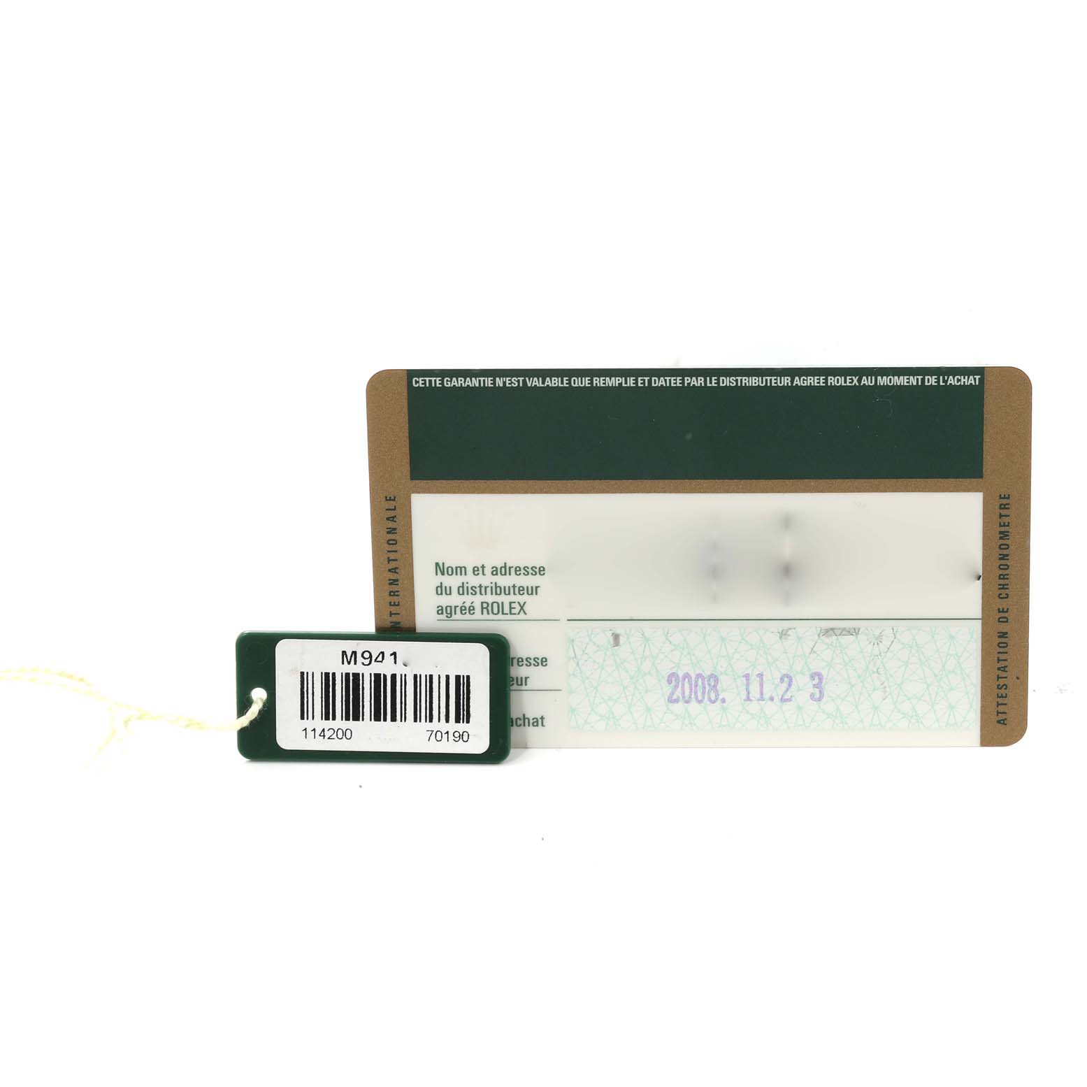 This image shows the warranty card and tag for the Rolex Air-King 114200 Men's Stainless Steel Blue Dial 114200 Men's Stainless Steel Blue Dial watch, displayed from a top-down angle.