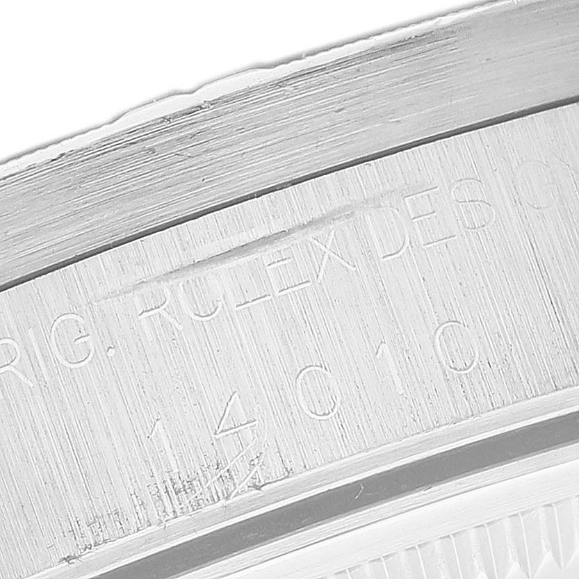 The image shows a close-up of the engraved inner bezel of the Rolex Air-King 14010 Men's Stainless Steel Black Dial 14010 Men's Stainless Steel Black Dial watch.