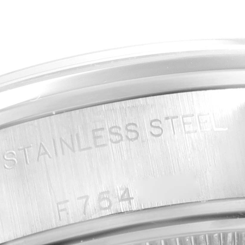 This image shows a close-up of the stainless steel casing and part of the bezel of a Rolex Date 79160 Women's Stainless Steel Blue Dial 79160 Women's Stainless Steel Blue Dial watch.