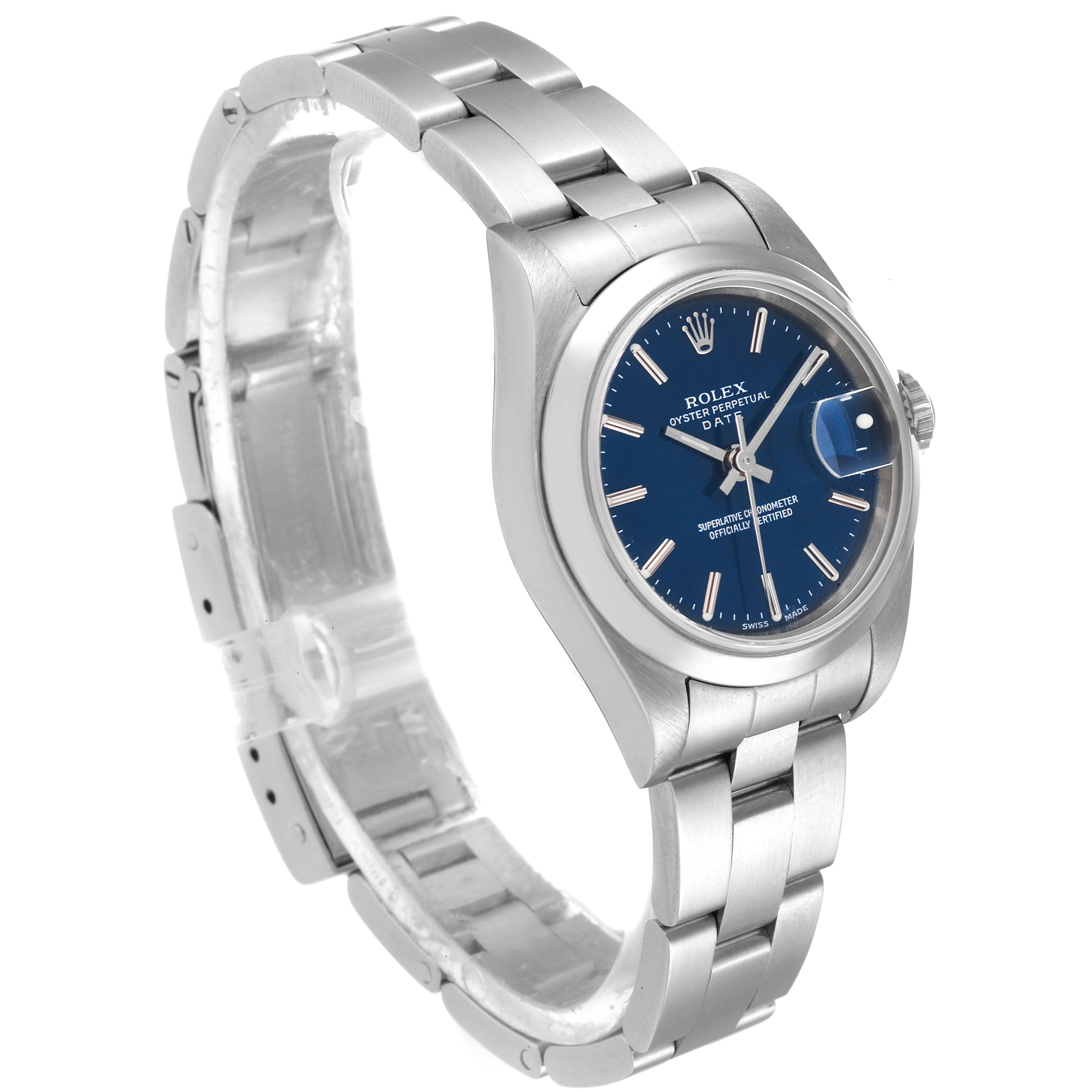 The image shows a side-angled view of a Rolex Date 79160 Women's Stainless Steel Blue Dial 79160 Women's Stainless Steel Blue Dial model watch, highlighting the face, bezel, bracelet, and clasp.