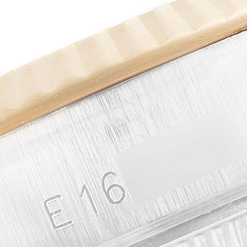 This image shows a close-up of the bezel and part of the case back with markings of the Rolex Datejust 69173 Women
s Steel and Gold (two tone) Champagne Dial 69173 Women
s Steel and Gold (two tone) Champagne Dial watch.