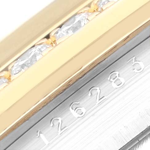 This image shows a close-up of the bezel and the serial number engraving on a Rolex Datejust 126283RBR Men's Steel and Gold (two tone) Champagne Dial 126283RBR Men's Steel and Gold (two tone) Champagne Dial watch.