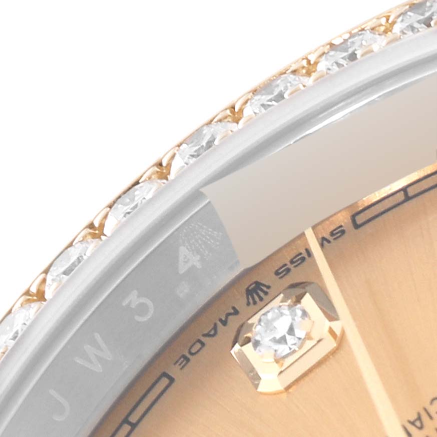 The image shows a close-up of the bezel, dial, and markers of a Rolex Datejust 126283RBR Men's Steel and Gold (two tone) Champagne Dial 126283RBR Men's Steel and Gold (two tone) Champagne Dial watch, highlighting diamond detailing.