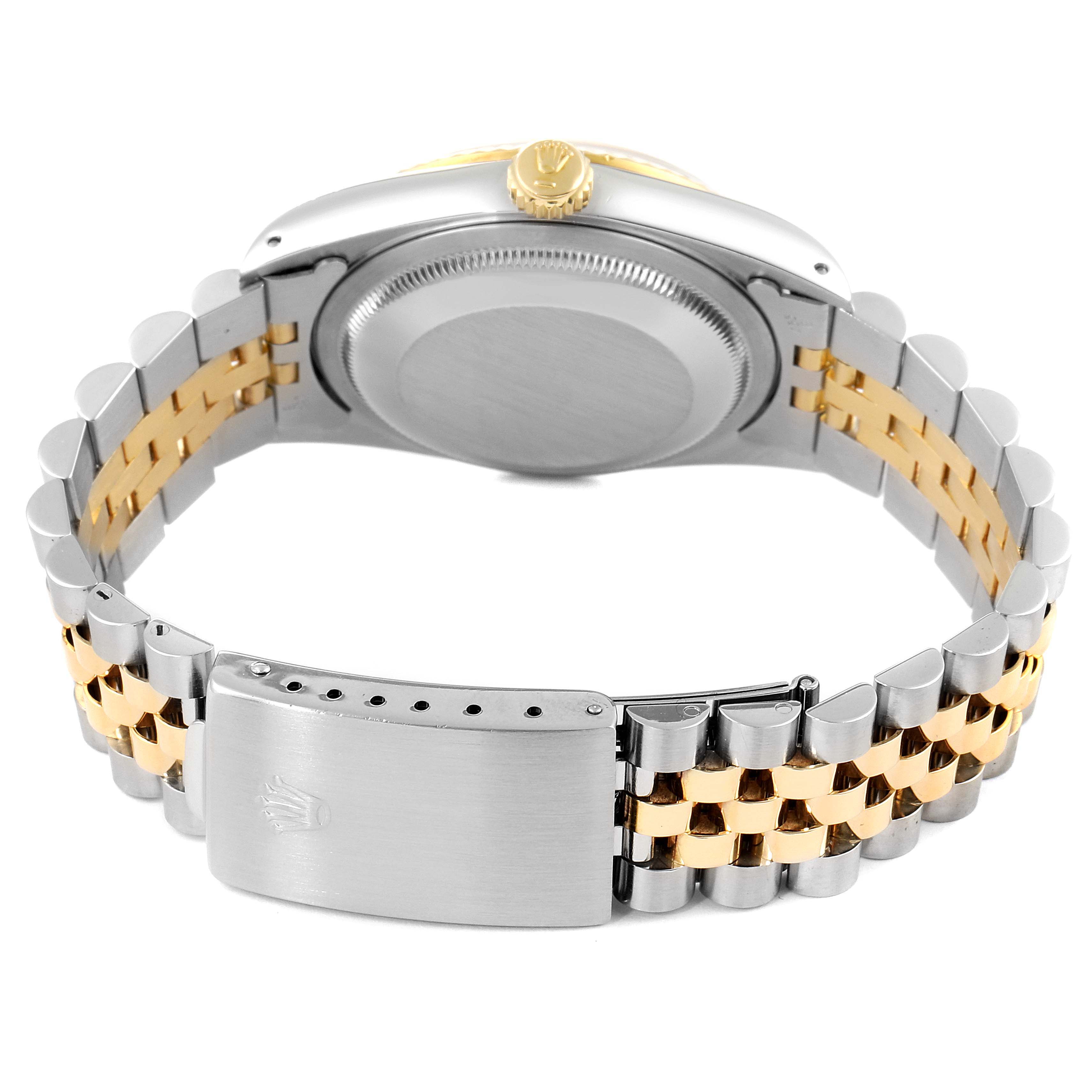 This Rolex Datejust 16233 Men's Steel and Gold (two tone) Champagne Dial 16233 Men's Steel and Gold (two tone) Champagne Dial watch is shown from the back, displaying the case back, crown, and bicolor bracelet with clasp.