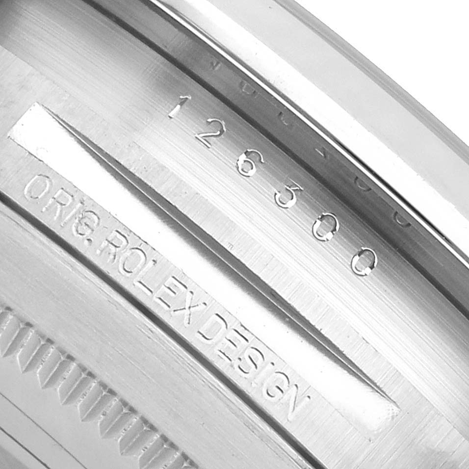 This close-up image shows the inner bezel engravings of a Rolex Datejust 41 126300 Men's Stainless Steel White Dial, featuring model numbers and "ORG.ROLEX DESIGN."