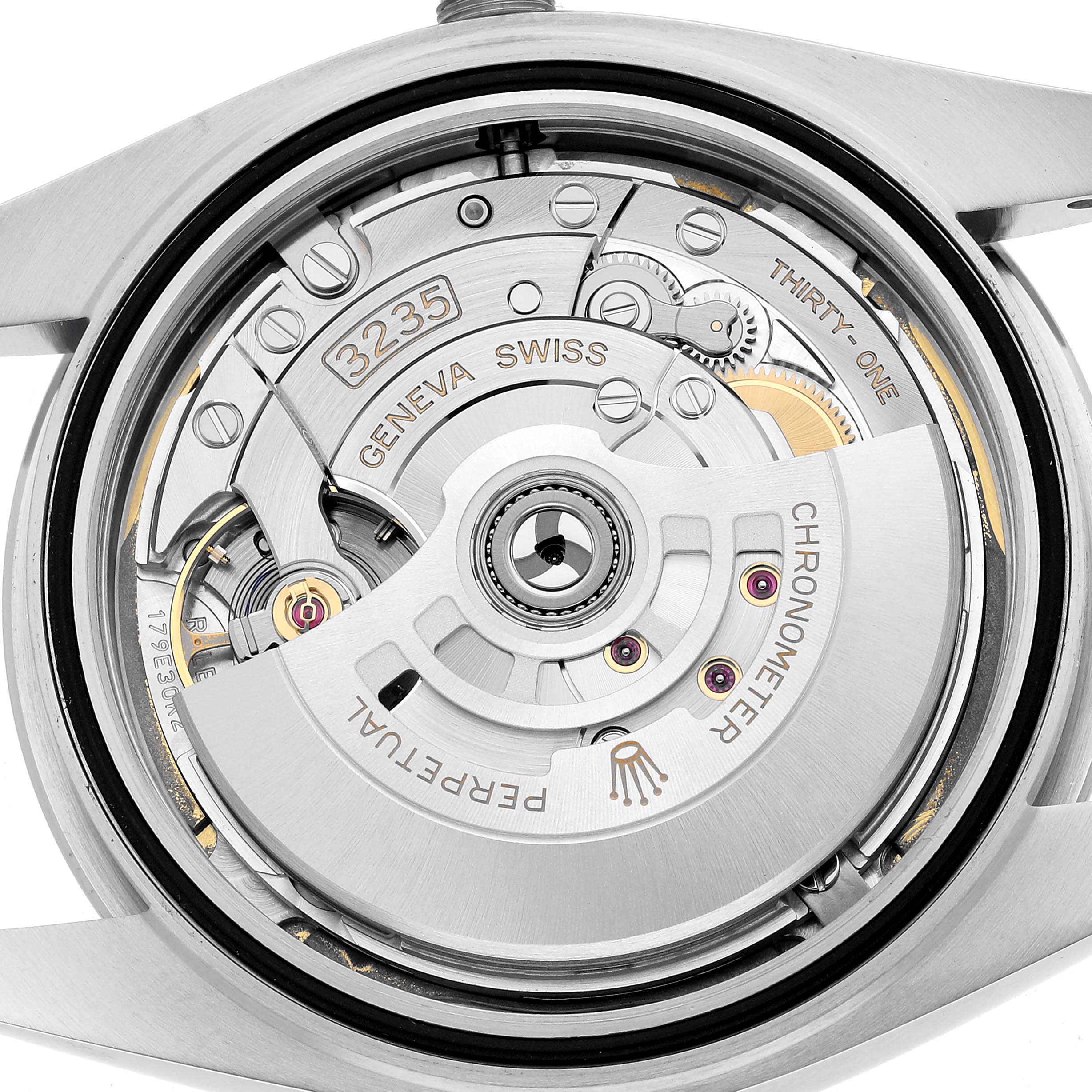 The image shows the back of a Rolex Datejust 41 126300 Men's Stainless Steel White Dial, highlighting its movement and internal components.