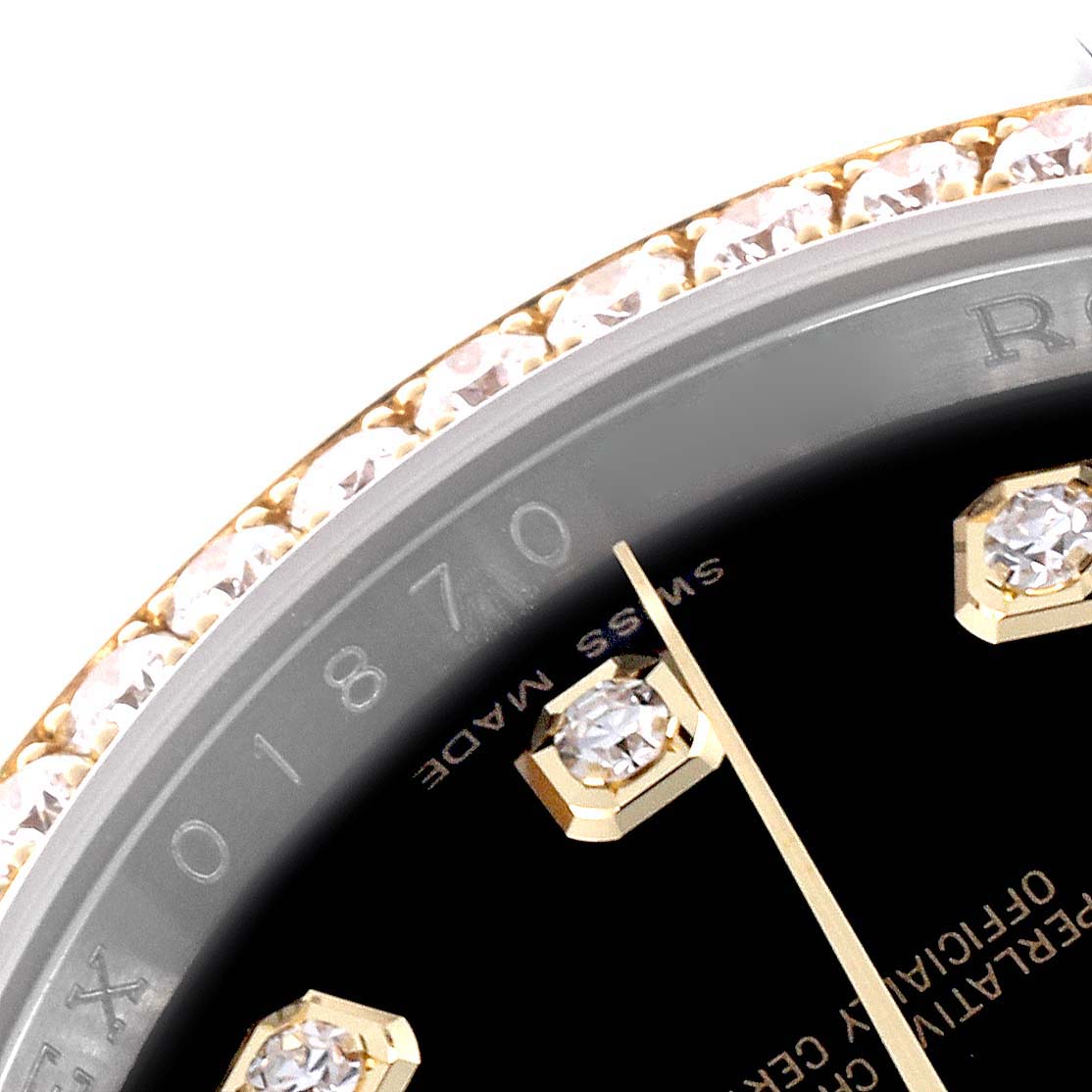 The image shows a close-up of the Rolex Datejust 116243 Men's Steel and Gold (two tone) Black Dial 116243 Men's Steel and Gold (two tone) Black Dial watch's bezel and part of the dial with diamond hour markers.