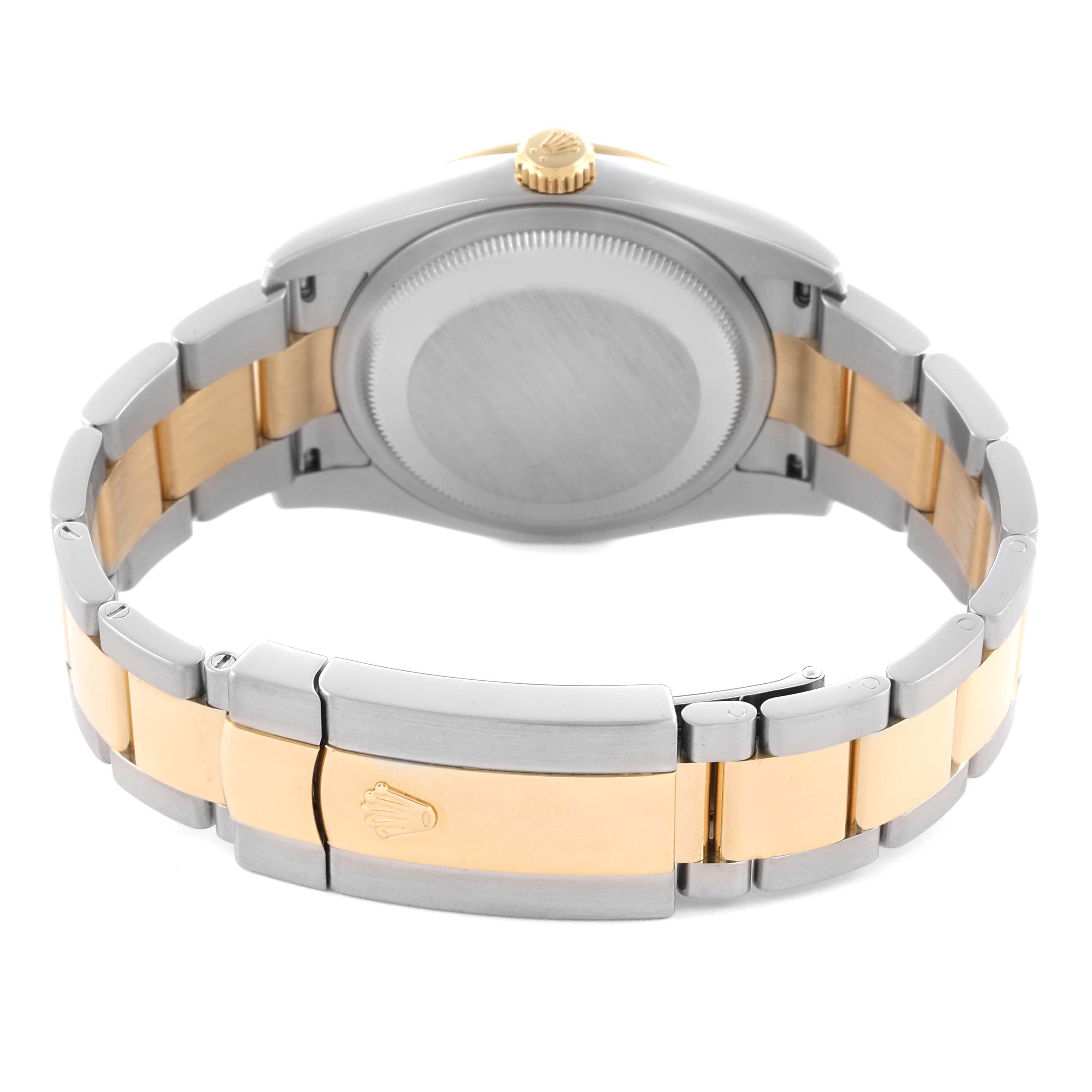 The Rolex Datejust 116243 Men's Steel and Gold (two tone) Black Dial 116243 Men's Steel and Gold (two tone) Black Dial watch is shown from the back, displaying its case back and two-tone bracelet with clasp.