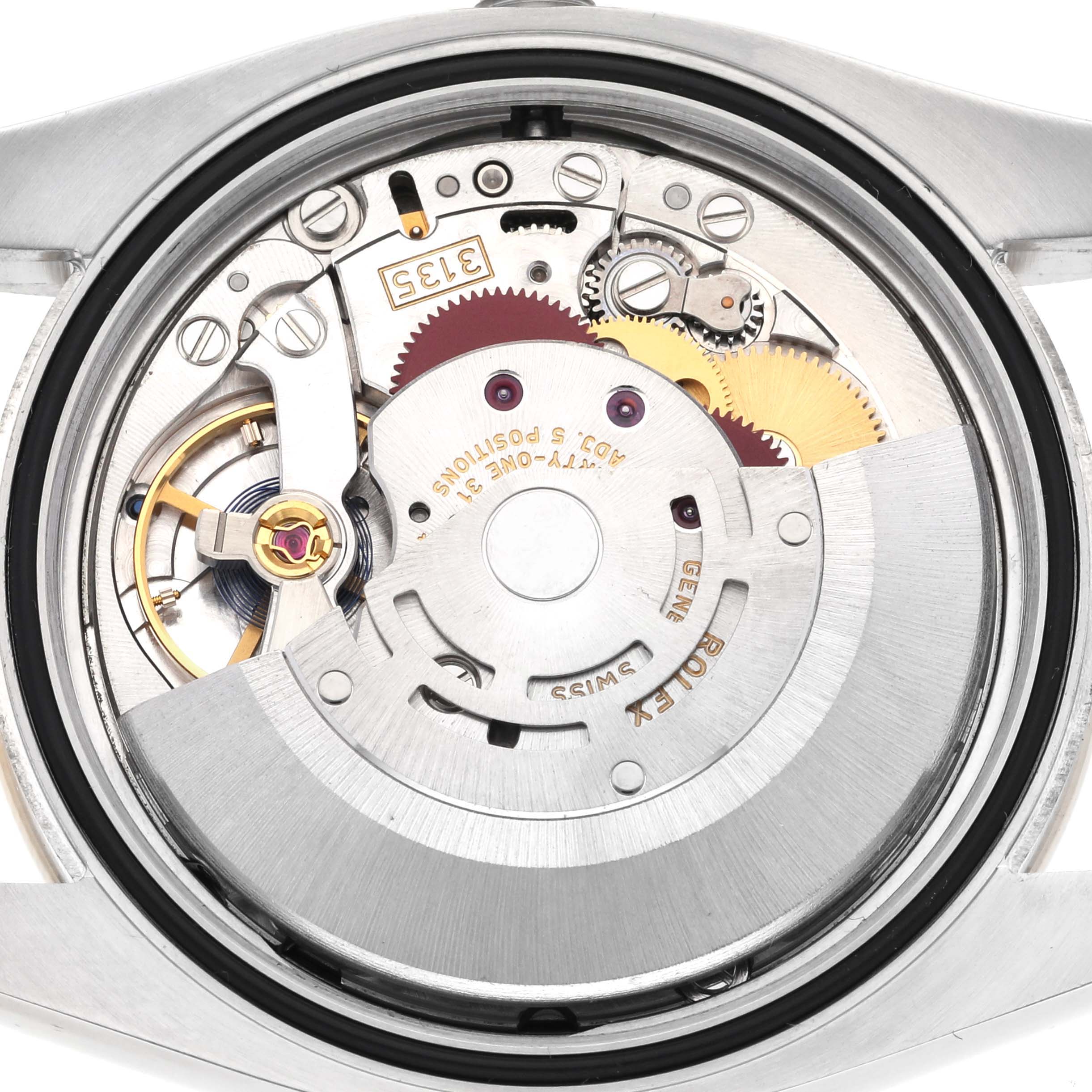 This image shows the movement mechanism of a Rolex Datejust 116243 Men's Steel and Gold (two tone) Black Dial 116243 Men's Steel and Gold (two tone) Black Dial watch from the back.