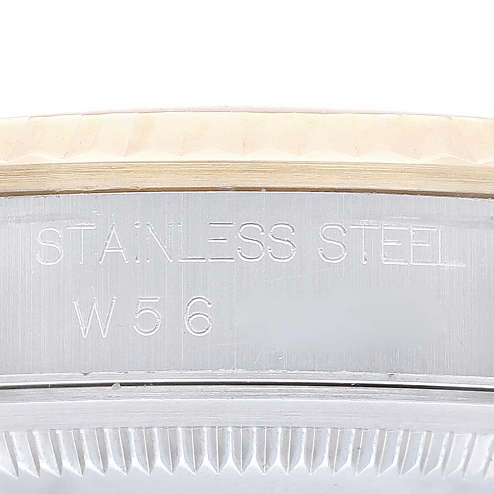 This image shows a close-up of the case side of a Rolex Datejust 16233 Men's Steel and Gold (two tone) Champagne Dial 16233 Men's Steel and Gold (two tone) Champagne Dial watch, highlighting the stainless steel material inscription.