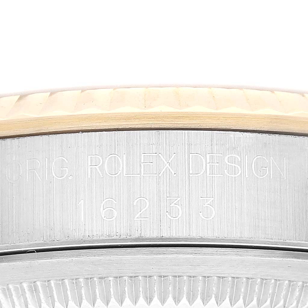 This image shows a close-up view of the side case and reference number of the Rolex Datejust 16233 Men's Steel and Gold (two tone) Champagne Dial 16233 Men's Steel and Gold (two tone) Champagne Dial model.