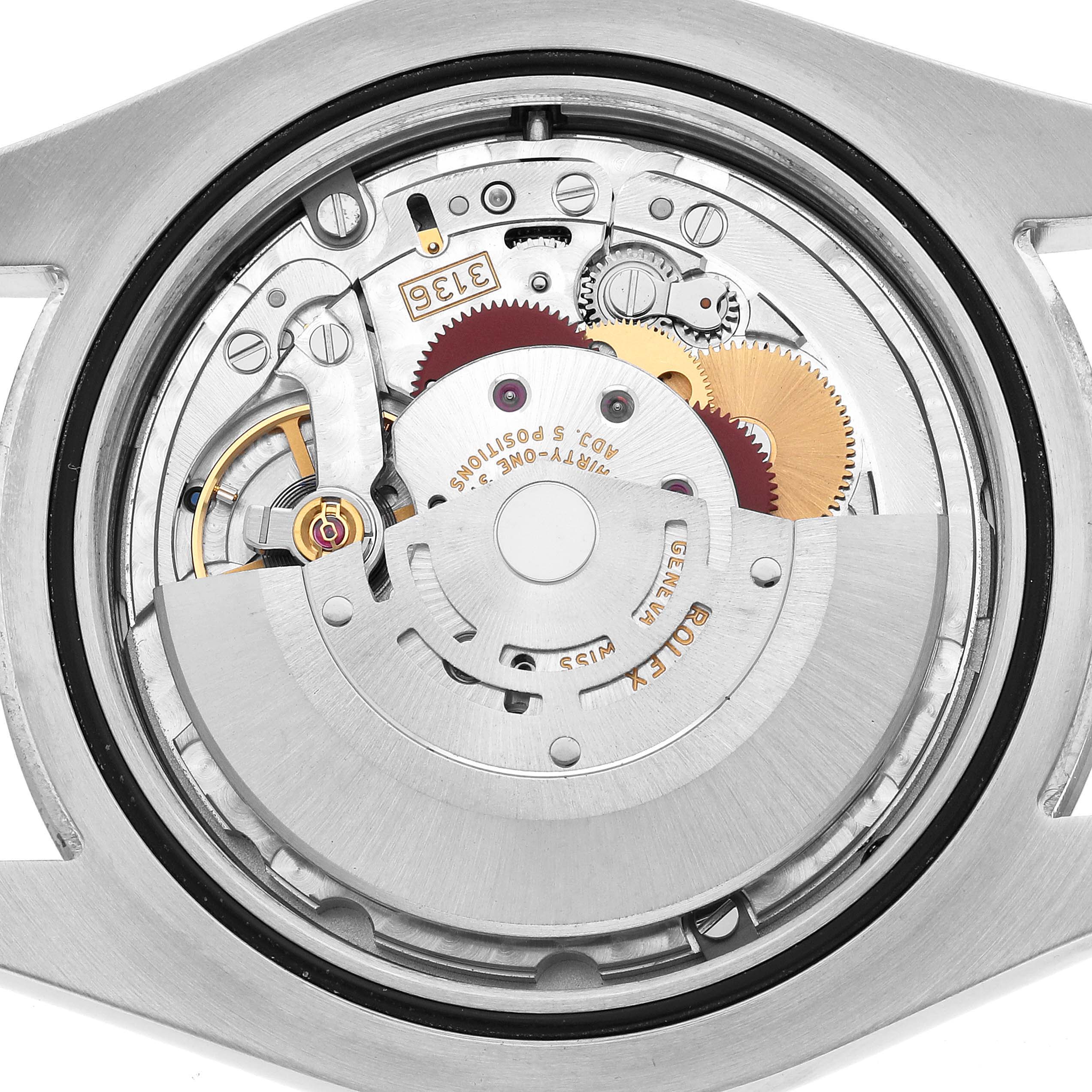 This image shows the movement of a Rolex Datejust 41 116334 Men's Stainless Steel Silver Dial, highlighting the intricate gears and internal components from the back.