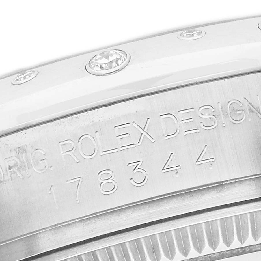 The image shows a detailed side view of the Rolex Mid-Size 178344 Women's Stainless Steel Silver Dial bezel with engraved model number 178344 and diamonds.