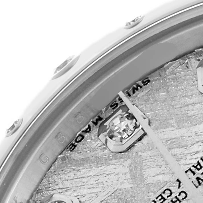The image shows a close-up of the dial and hands of a Rolex Mid-Size 178344 Women's Stainless Steel Silver Dial watch, highlighting a diamond marker and "Swiss Made" text.