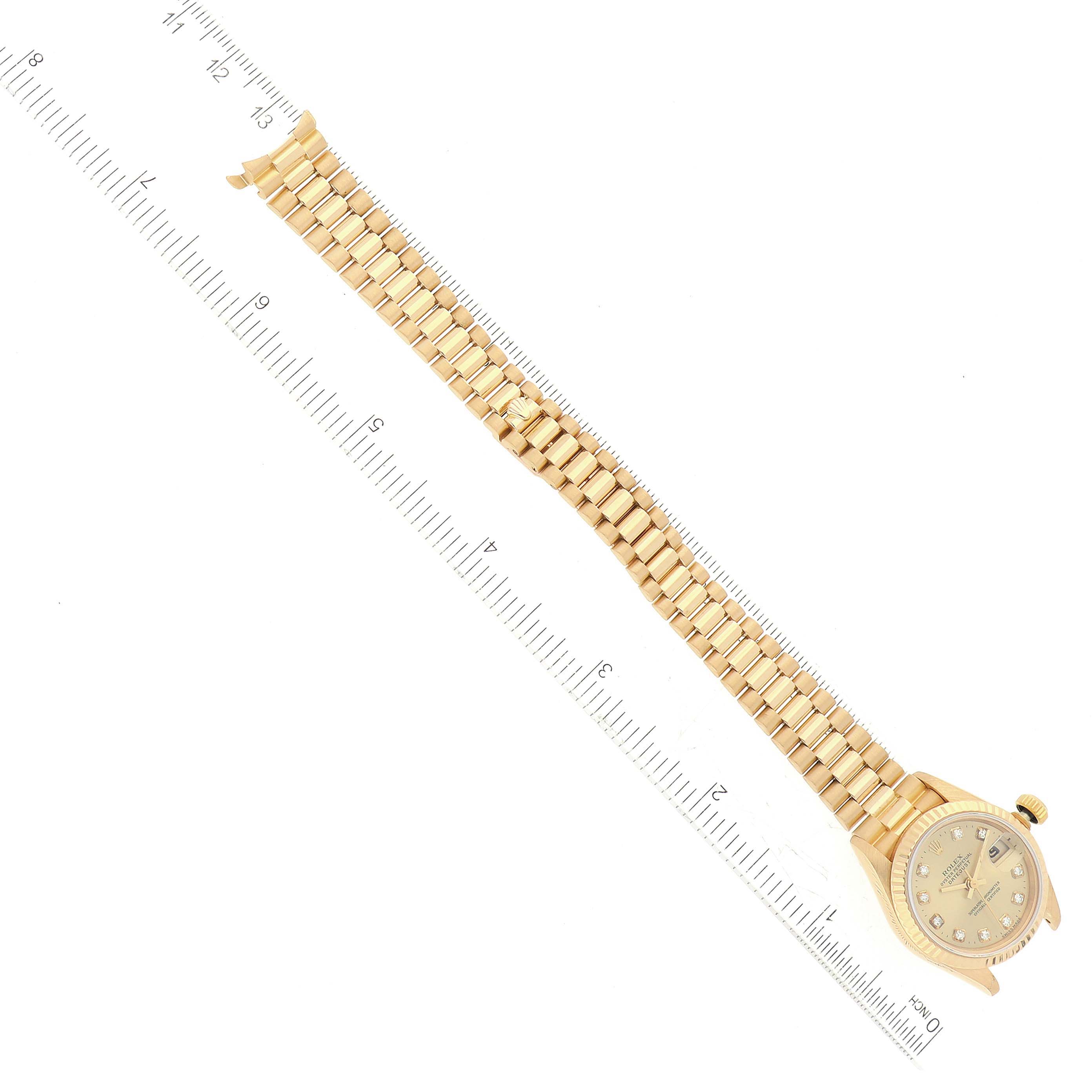 The Rolex President 69178G Women
s Yellow Gold Champagne Dial 69178G Women
s Yellow Gold Champagne Dial model watch is shown from an overhead angle, displaying the face, case, and full bracelet length.