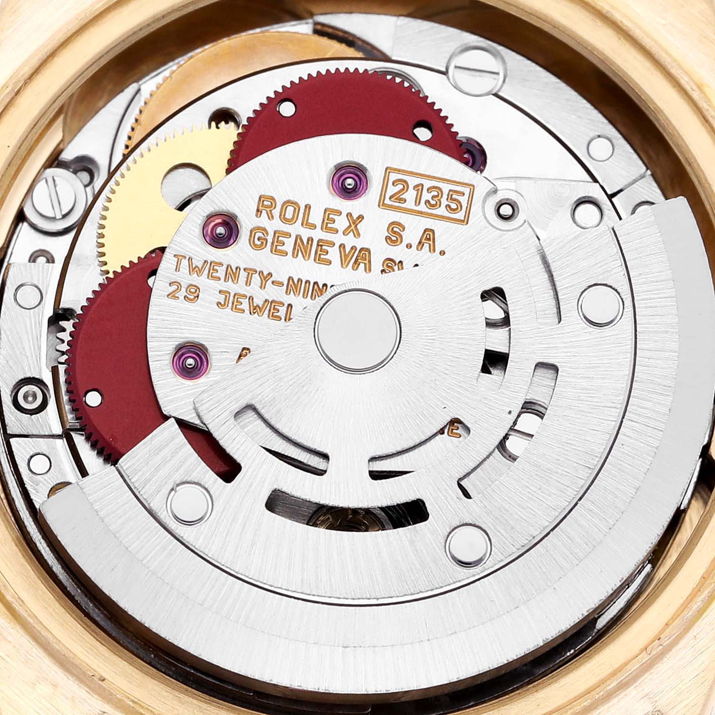 This image shows a close-up view of the movement inside the Rolex President 69178G Women
s Yellow Gold Champagne Dial 69178G Women
s Yellow Gold Champagne Dial watch, highlighting gears and inscriptions.