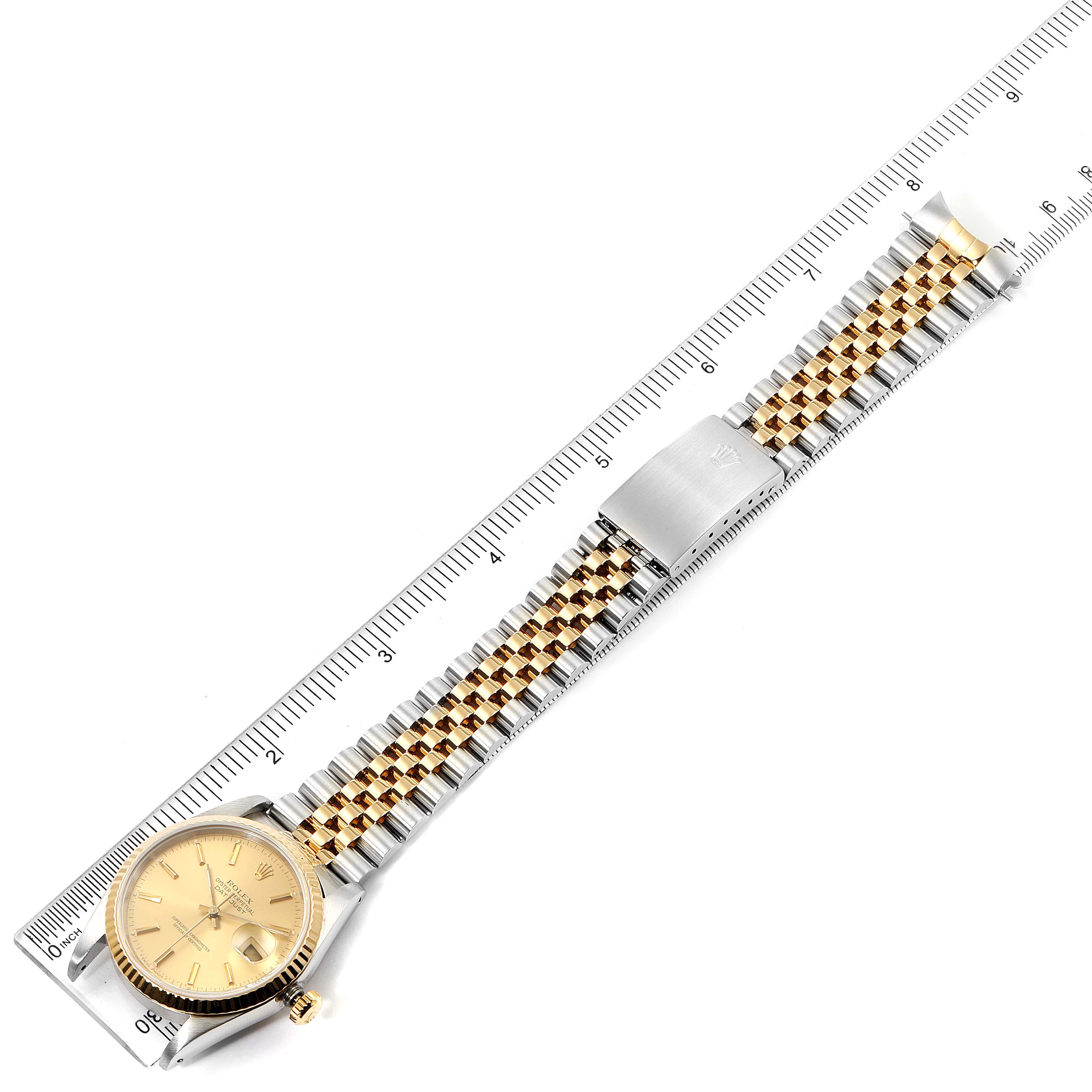 The image shows a Rolex Datejust 16233 Men's Steel and Gold (two tone) Champagne Dial 16233 Men's Steel and Gold (two tone) Champagne Dial watch laid flat, displaying the face, band, and clasp next to a ruler for reference.