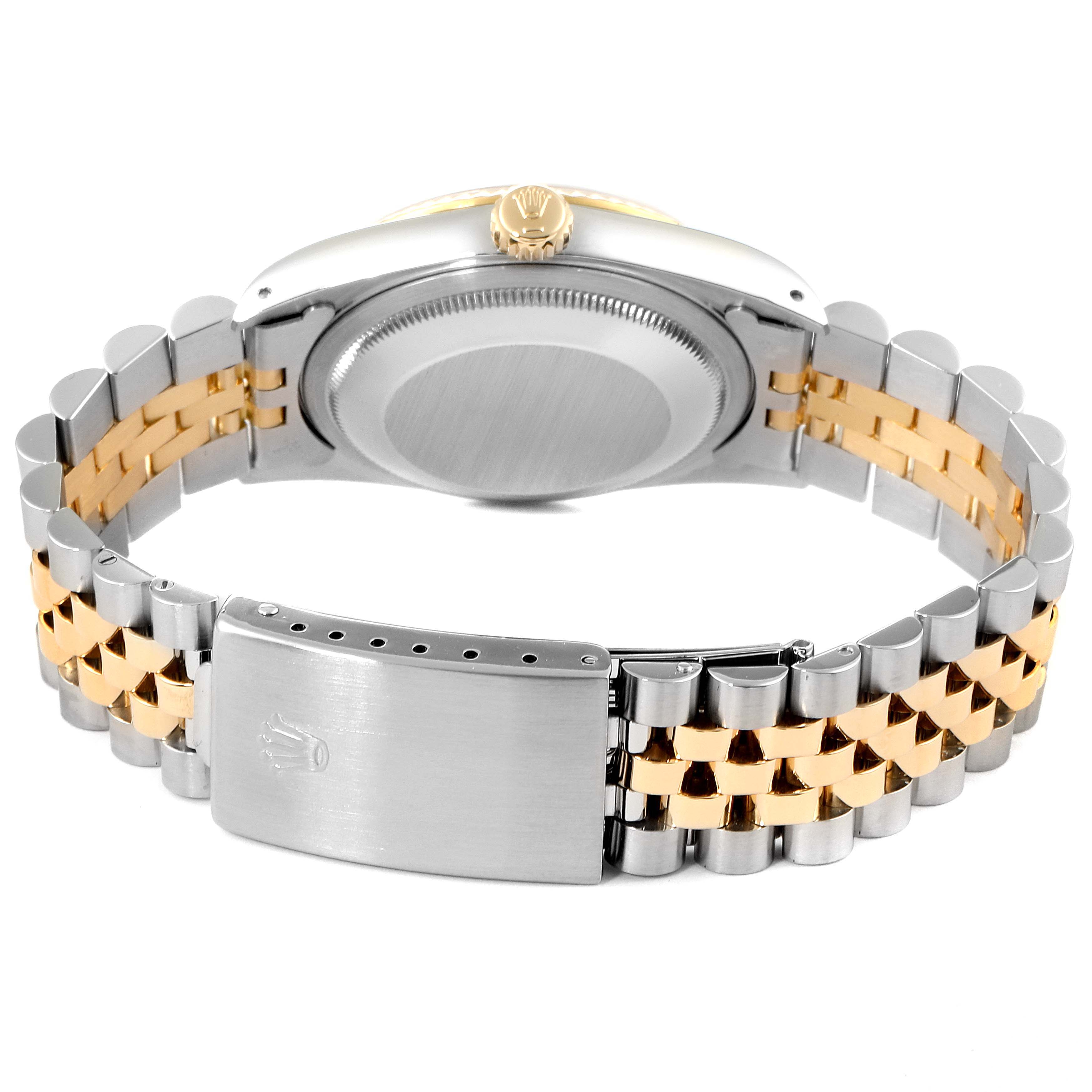 The Rolex Datejust 16233 Men's Steel and Gold (two tone) Champagne Dial 16233 Men's Steel and Gold (two tone) Champagne Dial watch is shown from the back, highlighting the case back, crown, and two-toned bracelet with clasp.