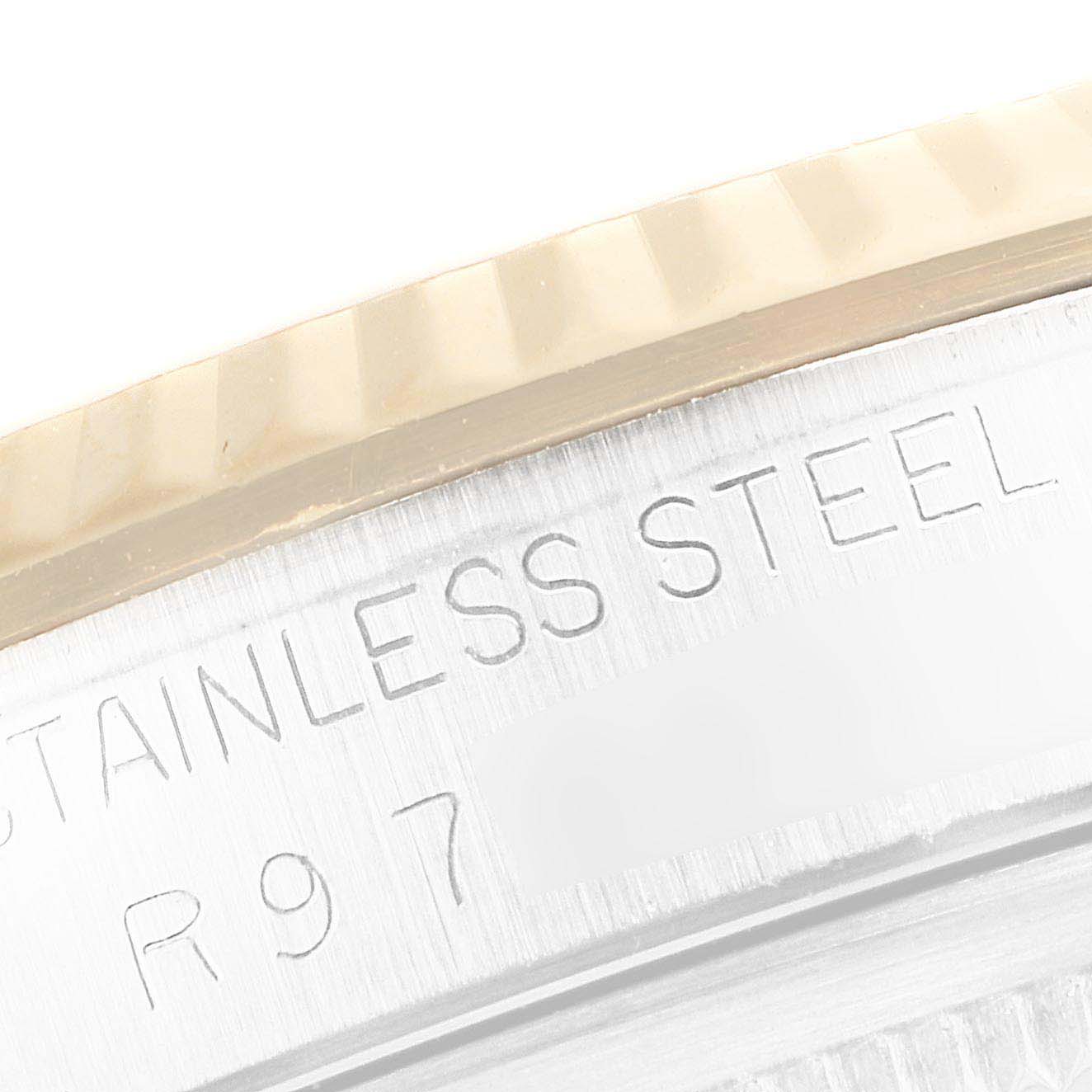 The image shows a close-up of the side of a Rolex Datejust 16233 Men's Steel and Gold (two tone) Champagne Dial 16233 Men's Steel and Gold (two tone) Champagne Dial watch case, highlighting the "Stainless Steel" engraving.