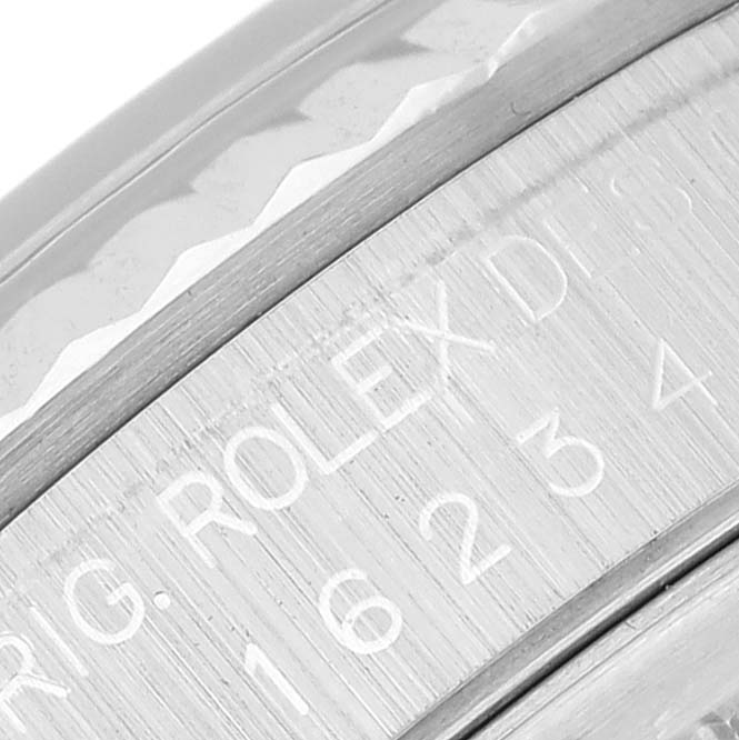 This close-up image shows the engraved inner ring (rehaut) of a Rolex Datejust 16234 Men's Stainless Steel Silver Dial 16234 Men's Stainless Steel Silver Dial watch.