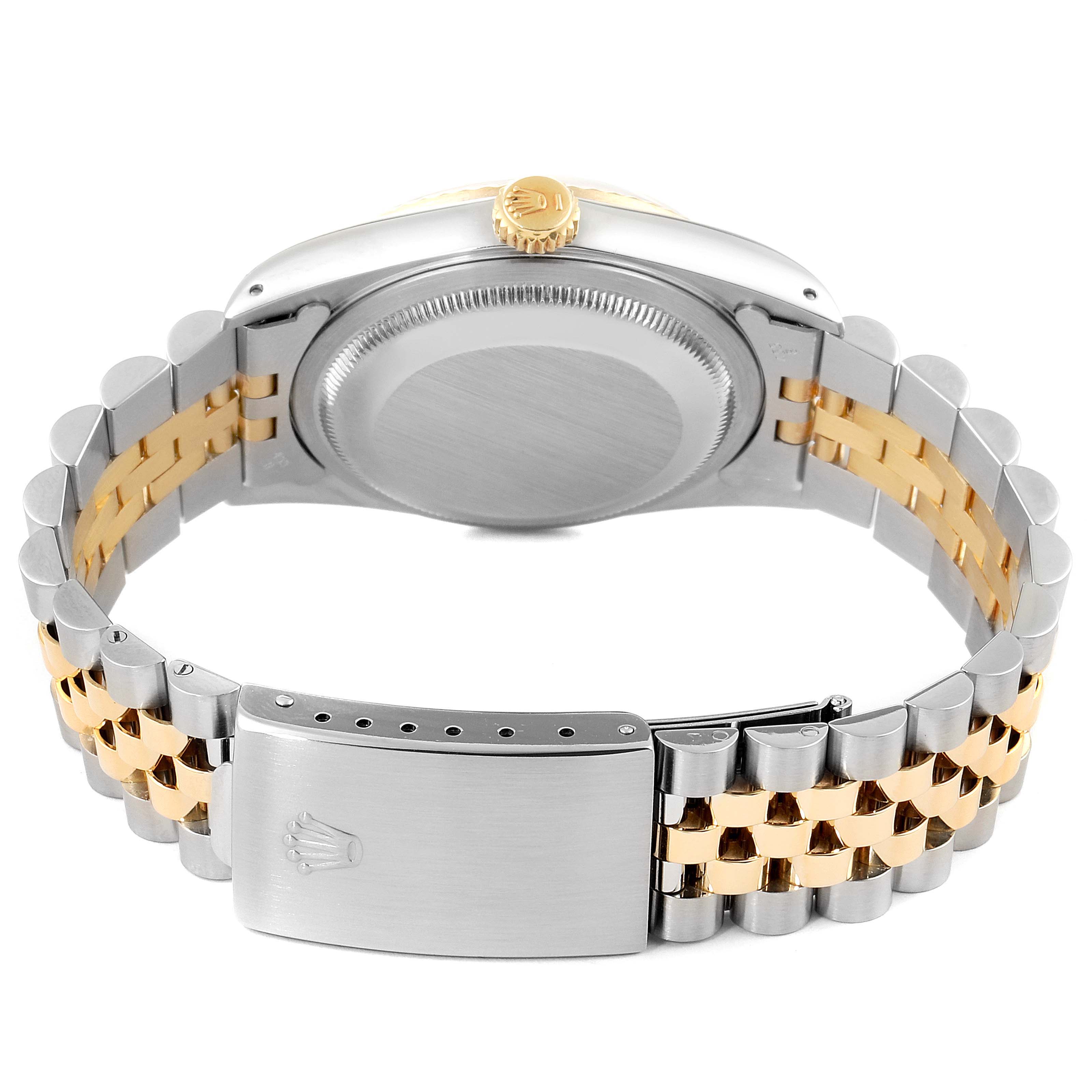 The image shows the backside and clasp of a Rolex Datejust 16233 Men's Steel and Gold (two tone) Black Dial 16233 Men's Steel and Gold (two tone) Black Dial watch, highlighting its two-tone bracelet and crown.