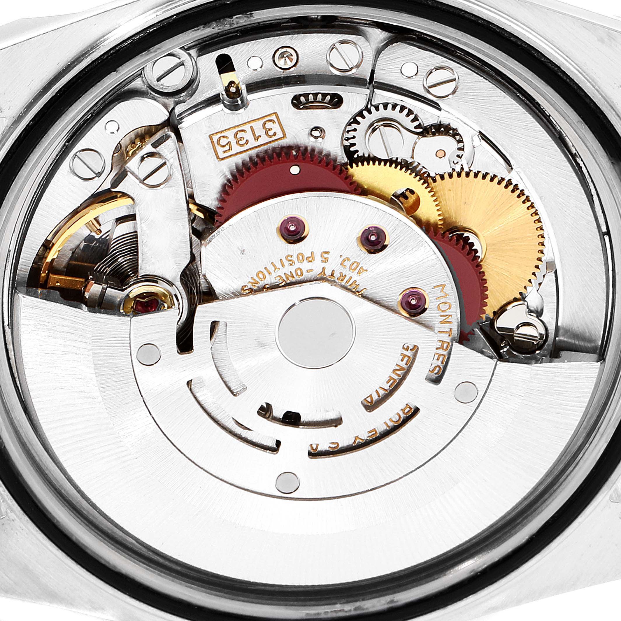 This close-up image shows the intricate mechanical movement of the Rolex Datejust 16233 Men's Steel and Gold (two tone) Black Dial 16233 Men's Steel and Gold (two tone) Black Dial watch from a back perspective.