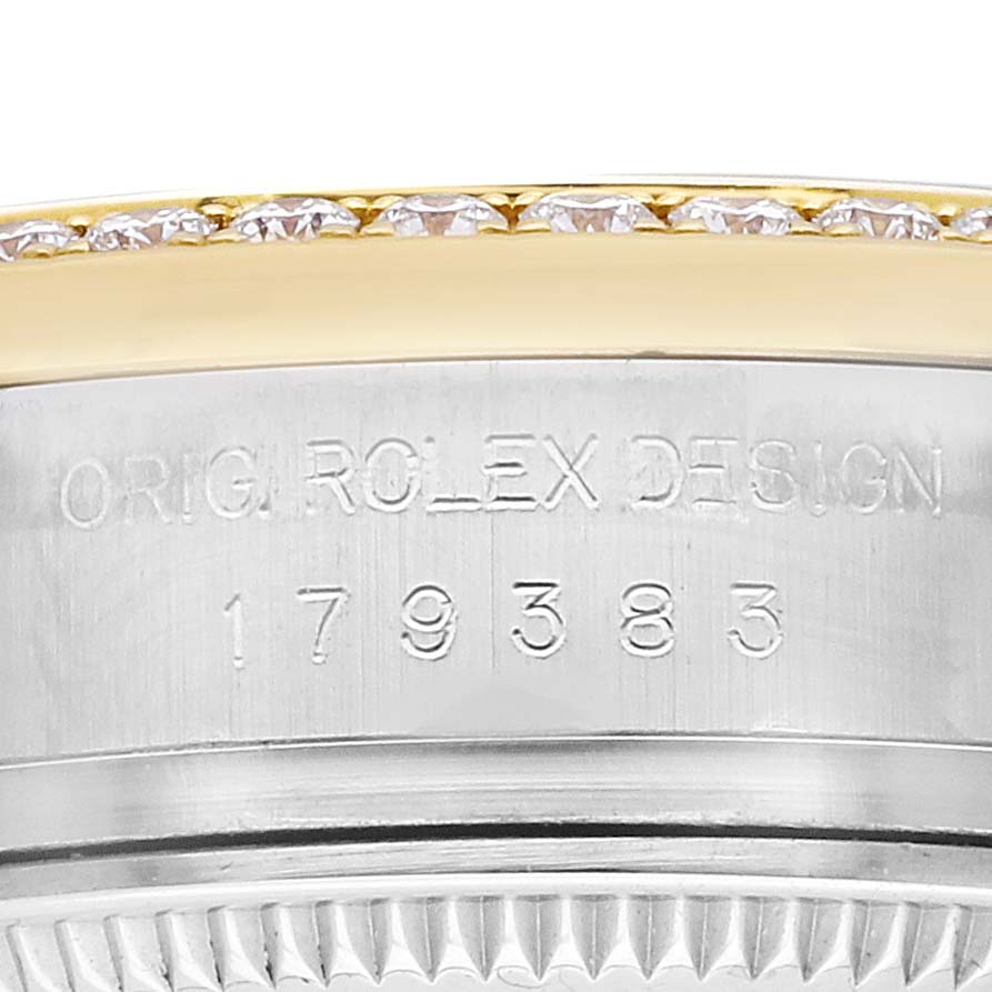 The image shows a close-up of the Rolex Datejust 179383 Women's Steel and Gold (two tone) Black Dial model's bezel and case side, featuring engraved text and diamonds on the bezel.