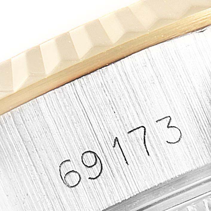The image shows a close-up of the case side and bezel of a Rolex Datejust 69173 Women's Steel and Gold (two tone) Champagne Dial 69173 Women's Steel and Gold (two tone) Champagne Dial watch, including part of the serial number engraving.