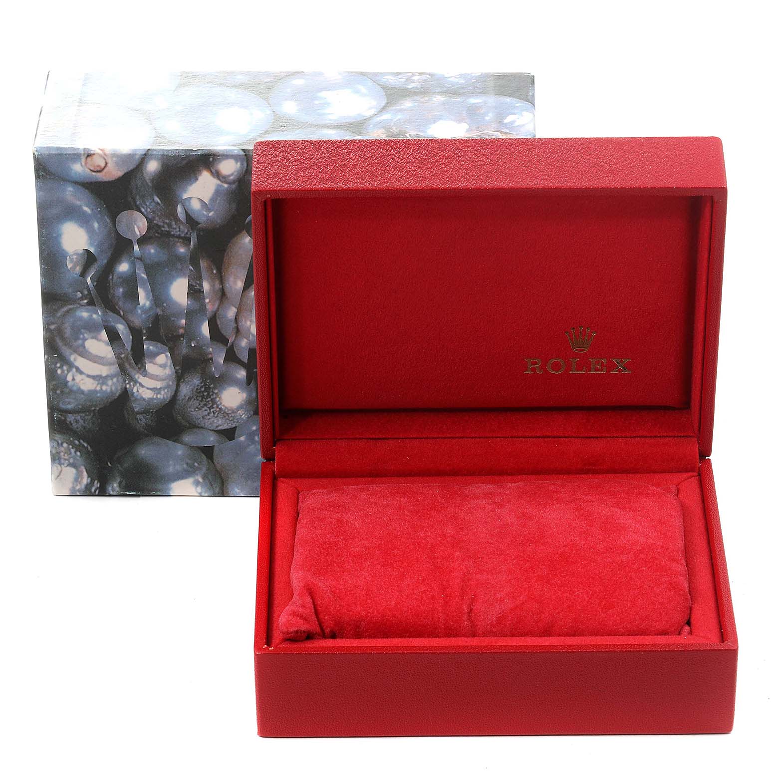 The image shows an open red Rolex box, with the Datejust model display pillow inside, and its outer packaging in the background.