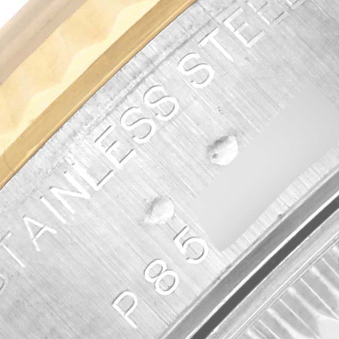 The image shows a close-up of the edge and lettering on the bezel of a Rolex Datejust 79173 Women's Steel and Gold (two tone) Silver Dial 79173 Women's Steel and Gold (two tone) Silver Dial watch.
