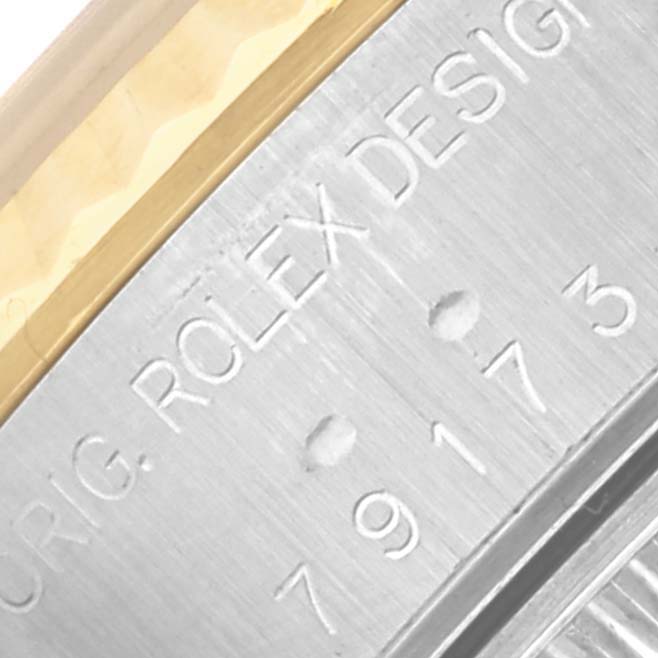 The image shows a close-up of the model number engraved on the side of a Rolex Datejust 79173 Women's Steel and Gold (two tone) Silver Dial 79173 Women's Steel and Gold (two tone) Silver Dial watch case.