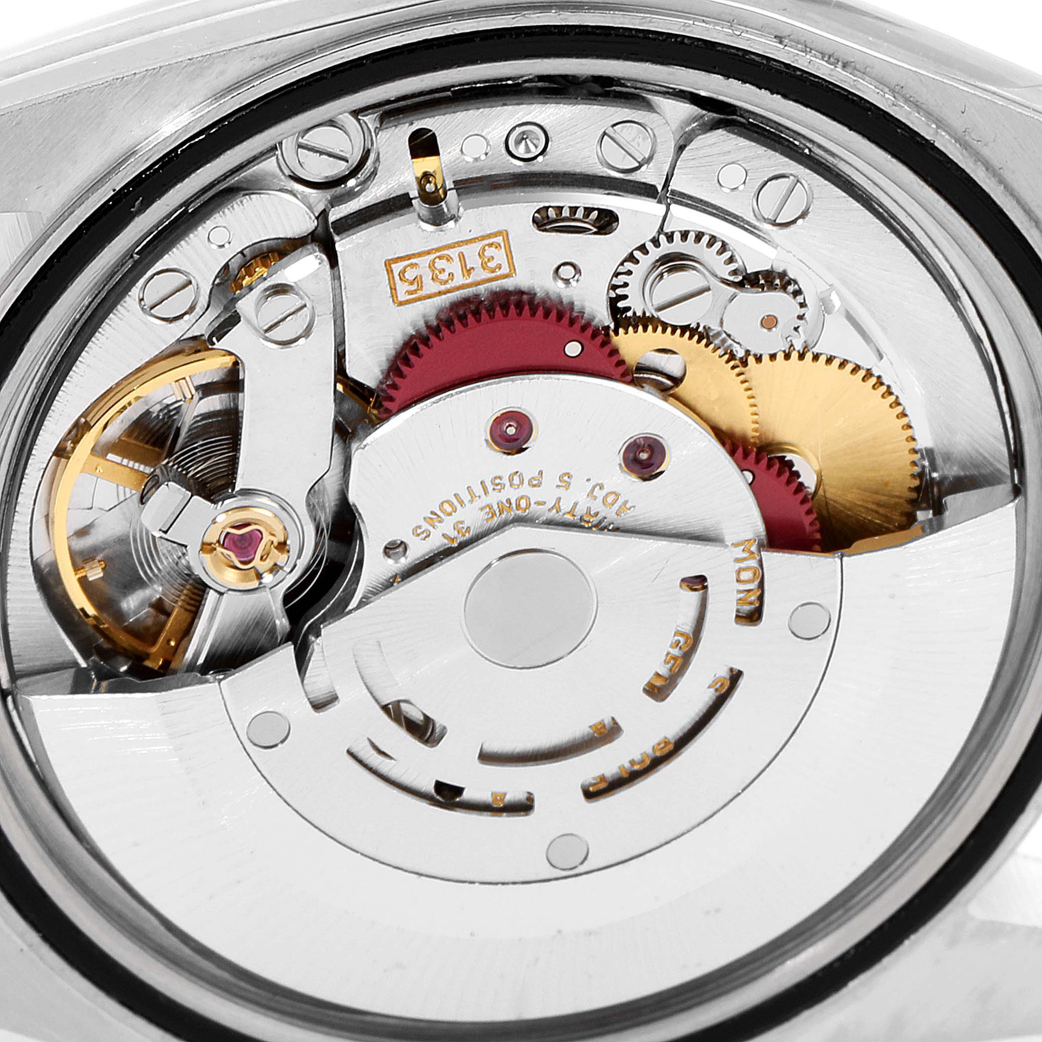 This image shows an up-close view of the movement mechanism of a Rolex Datejust 16233 Men's Steel and Gold (two tone) Blue Dial 16233 Men's Steel and Gold (two tone) Blue Dial watch, focusing on gears and components.