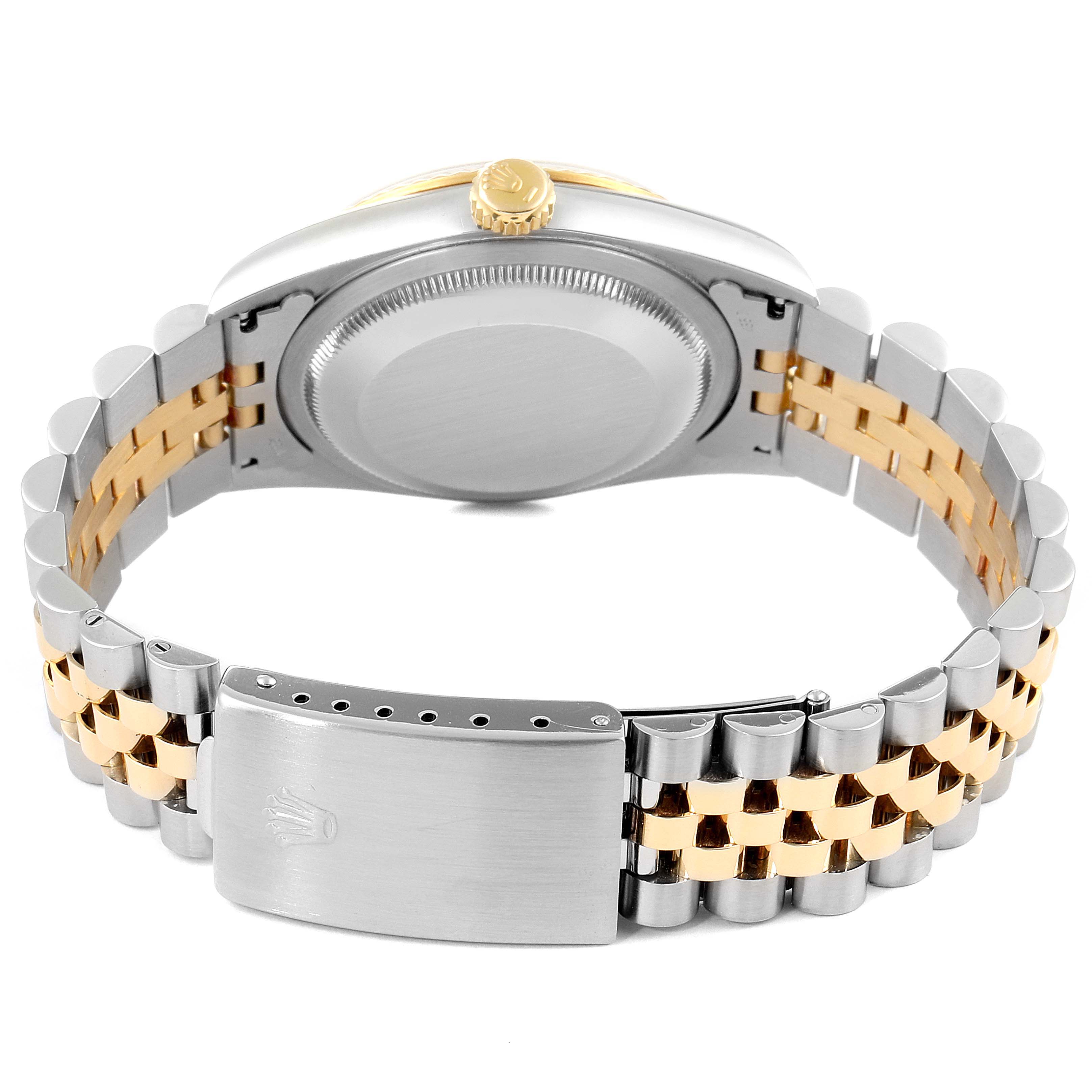 The image shows the back view of a Rolex Datejust 16233 Men's Steel and Gold (two tone) Blue Dial 16233 Men's Steel and Gold (two tone) Blue Dial watch, focusing on the case back and the two-tone bracelet with a signed clasp.