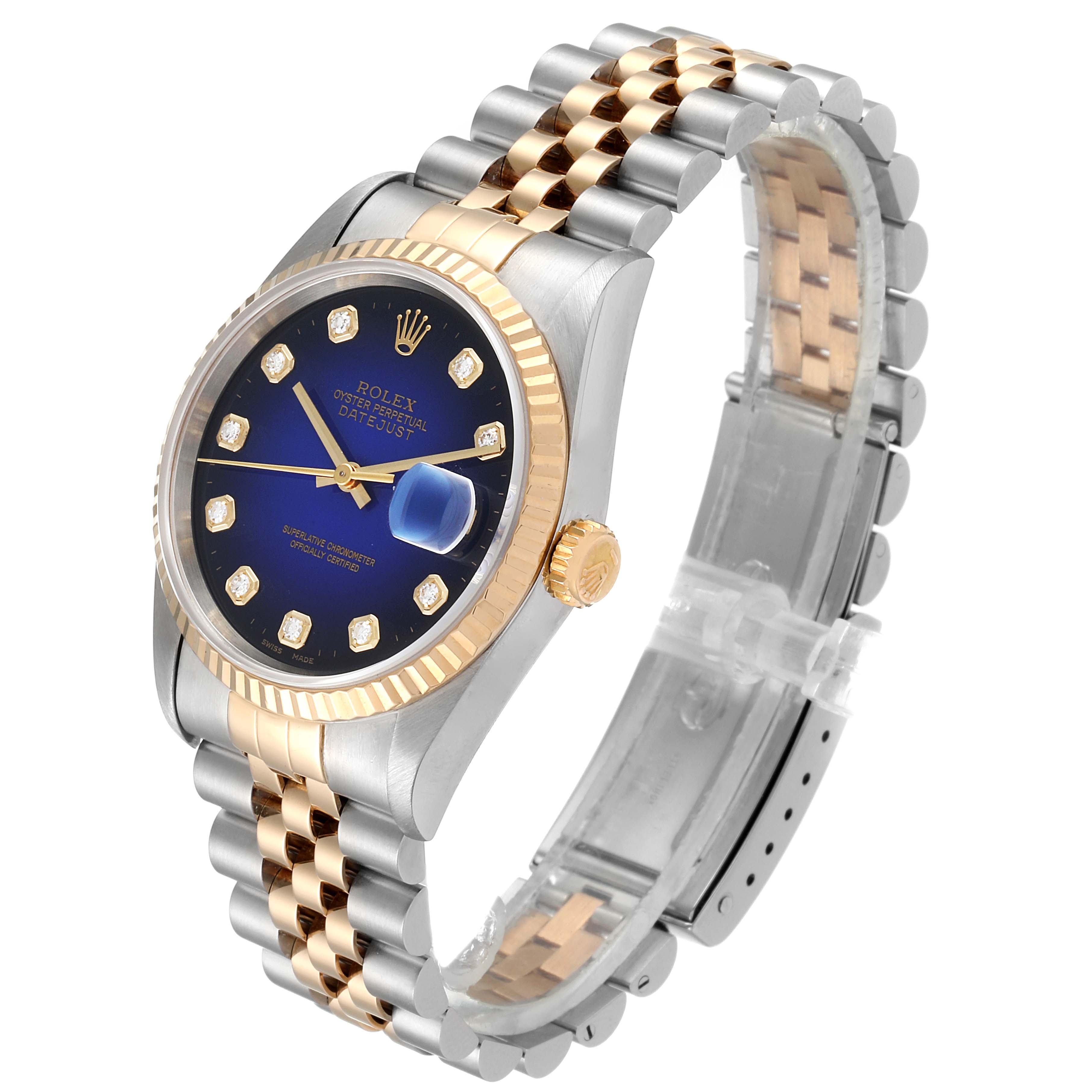 This image shows a Rolex Datejust 16233 Men's Steel and Gold (two tone) Blue Dial 16233 Men's Steel and Gold (two tone) Blue Dial watch at a side angle, highlighting its blue dial, diamond hour markers, gold bezel, and two-tone bracelet.