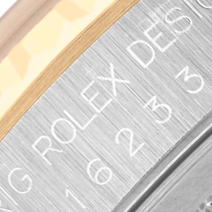 The image shows a close-up of the bezel and engraved text on the Rolex Datejust 16233 Men
s Steel and Gold (two tone) White Dial 16233 Men
s Steel and Gold (two tone) White Dial watch.