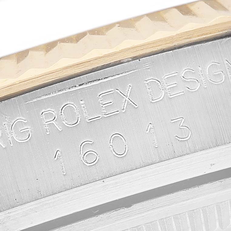 This image shows a close-up of the engraved model number and bezel section of a Vintage Collection Rolex watch.