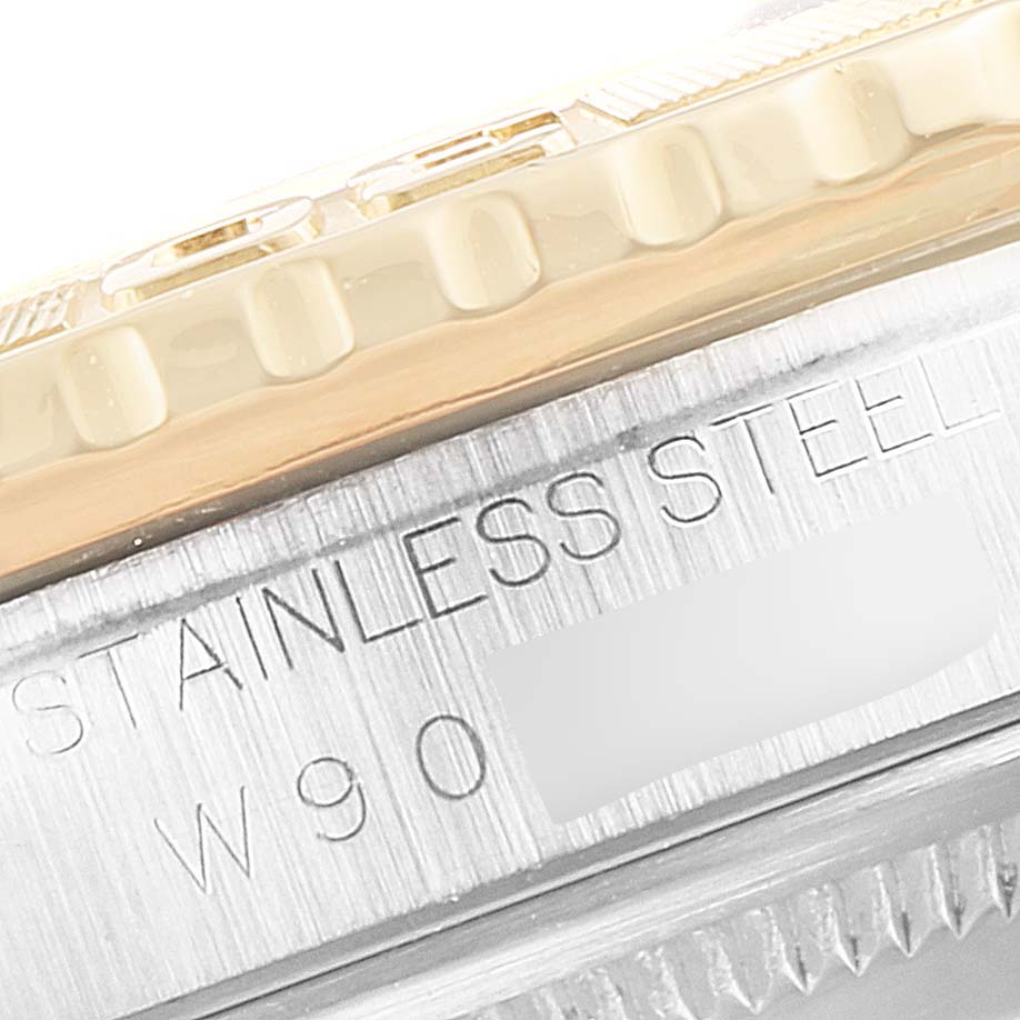 This image shows a close-up of the stainless steel bezel and engraved serial number of a Rolex Turn-o-Graph 16263 Men's Steel and Gold (two tone) Champagne Dial 16263 Men's Steel and Gold (two tone) Champagne Dial watch.