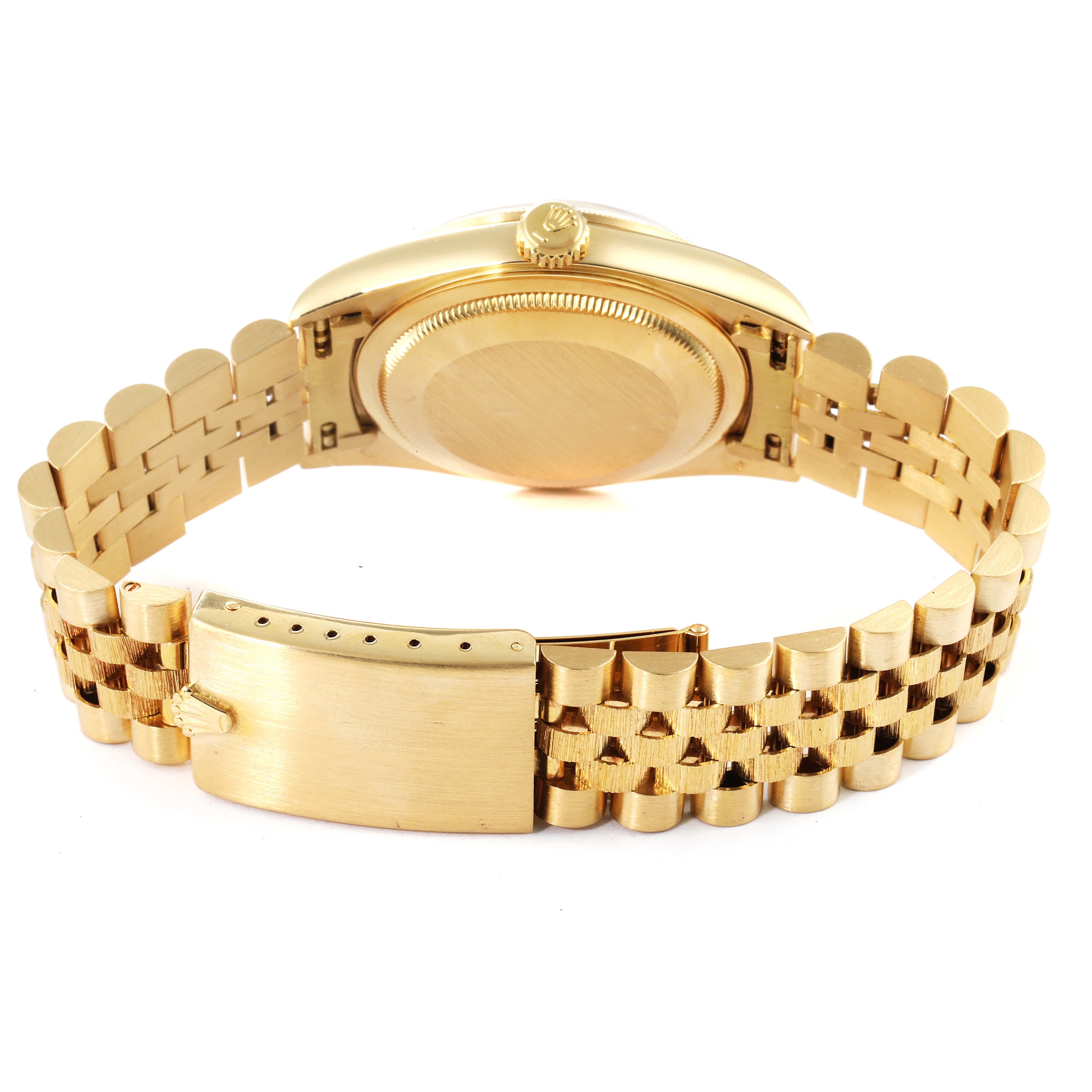 This image shows the backside and bracelet clasp of a Rolex Datejust 16248 Men's Yellow Gold Champagne Dial 16248 Men's Yellow Gold Champagne Dial watch, highlighting its gold case and Jubilee bracelet.