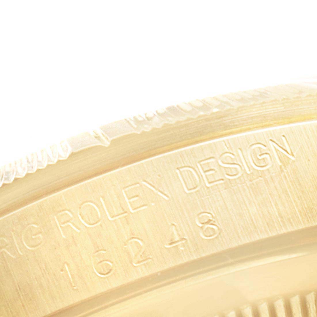 The image shows a close-up view of the engraved reference number and "Rolex Design" on the case of a Rolex Datejust 16248 Men's Yellow Gold Champagne Dial 16248 Men's Yellow Gold Champagne Dial watch.
