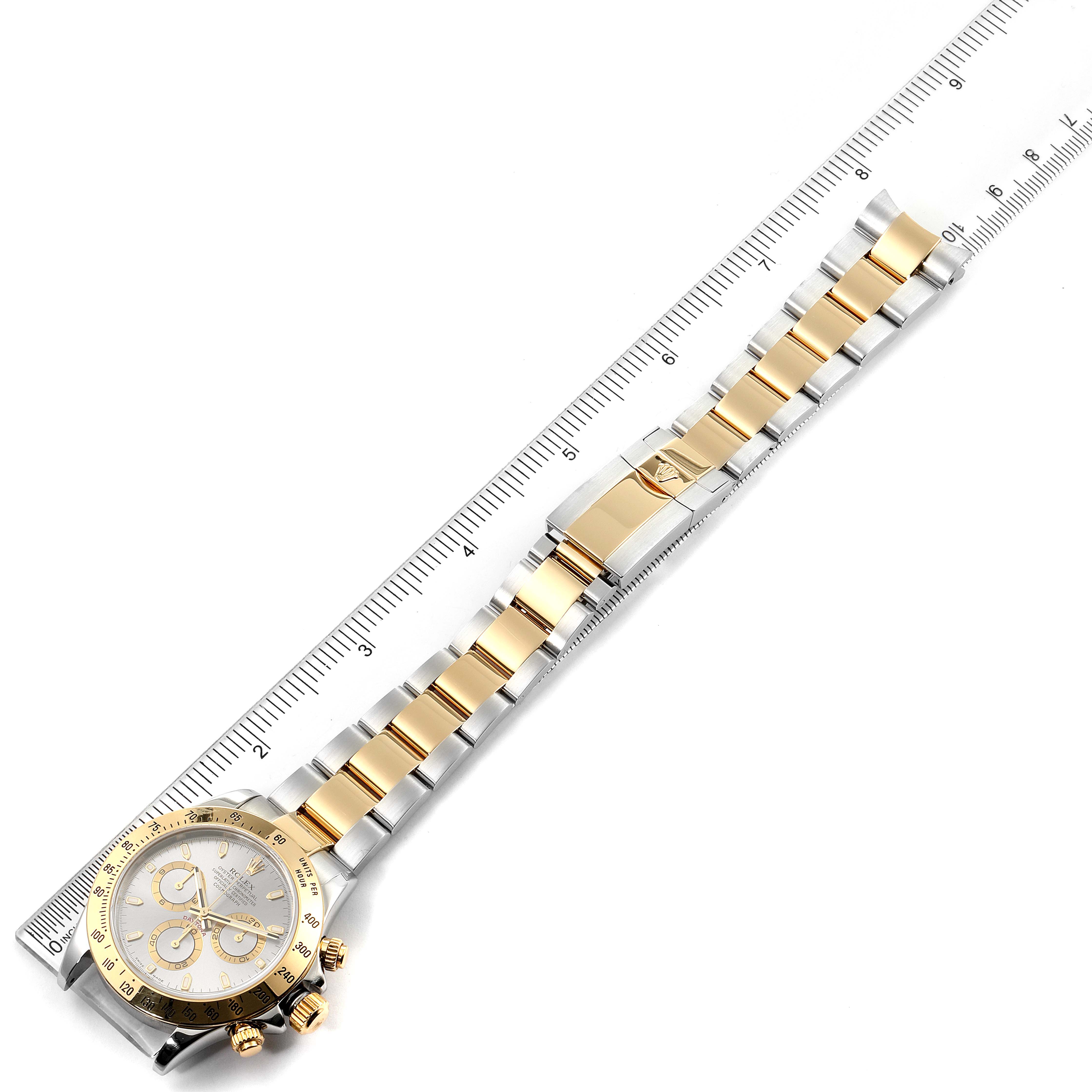 The Rolex Daytona 116523 Men's Steel and Gold (two tone) Grey Dial 116523 Men's Steel and Gold (two tone) Grey Dial watch is shown from a top-down angle, displaying its face, bezel, and entire bracelet.