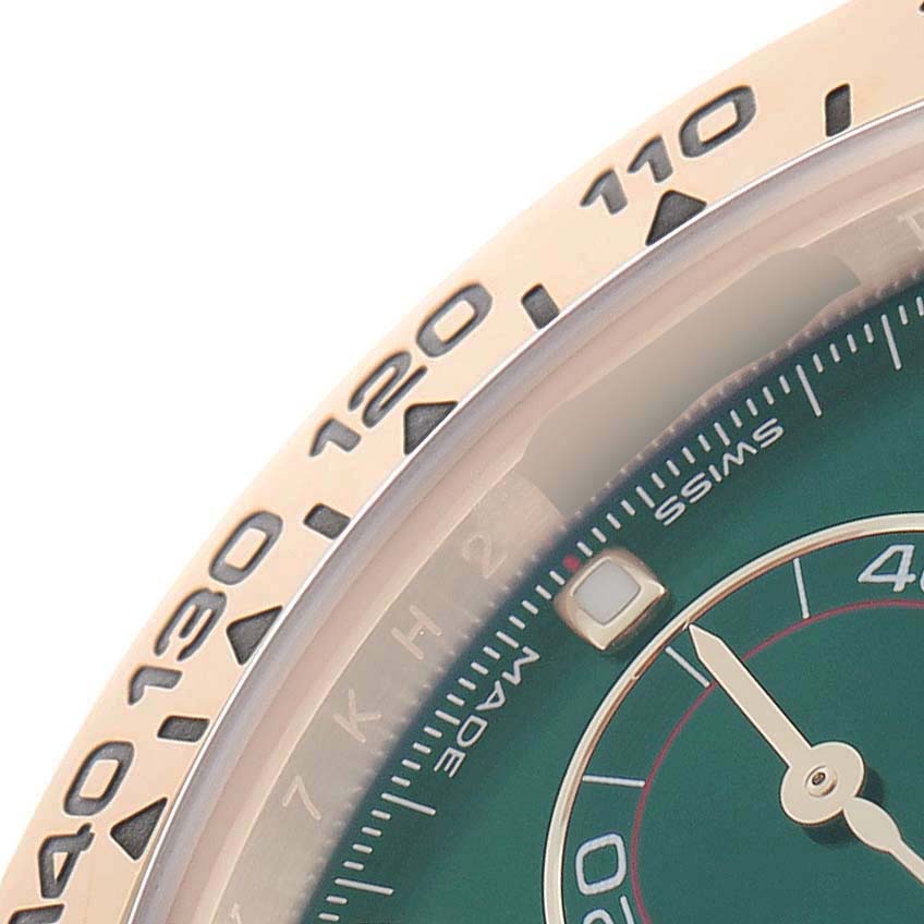 The image shows a close-up of a Rolex Daytona 116508 Men's Yellow Gold Green Dial's bezel and part of the dial, focusing on the tachymetric scale and minute markers.