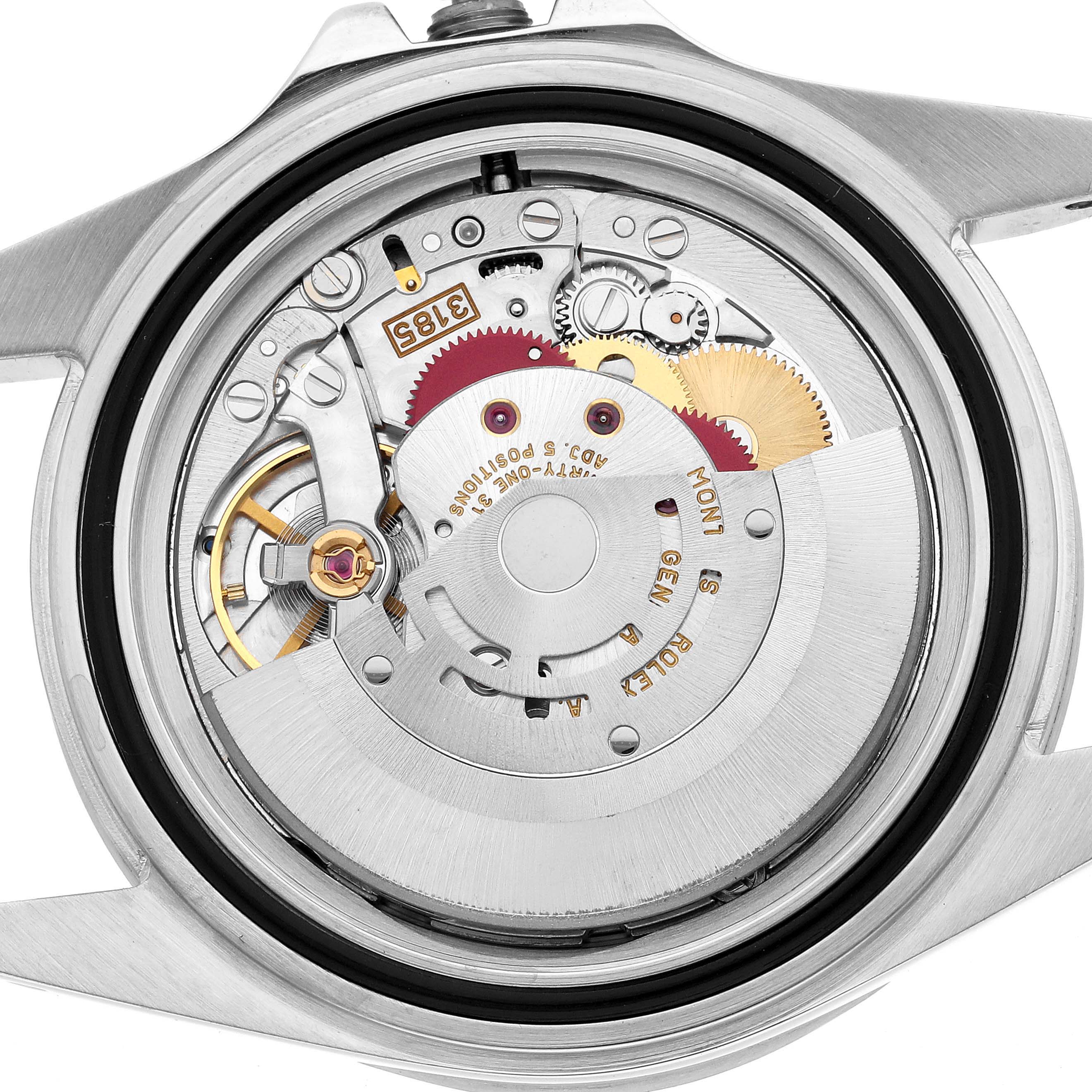 The image shows the movement of a Rolex Explorer 16570 Men's Stainless Steel White Dial watch from a back view, highlighting gears and the rotor.