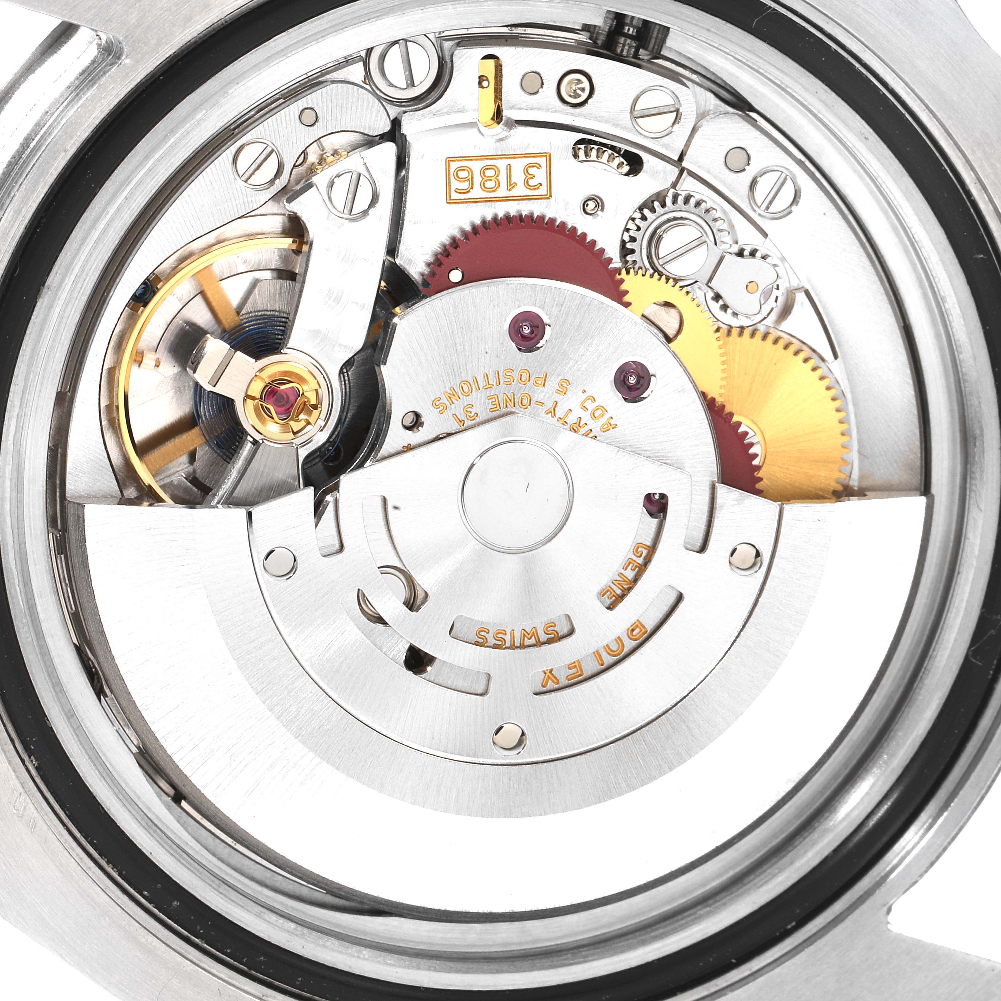 This is the internal view of the Rolex GMT-Master 116710 Men's Stainless Steel Black Dial 116710 Men's Stainless Steel Black Dial movement, showcasing gears, the rotor, and other mechanical components.