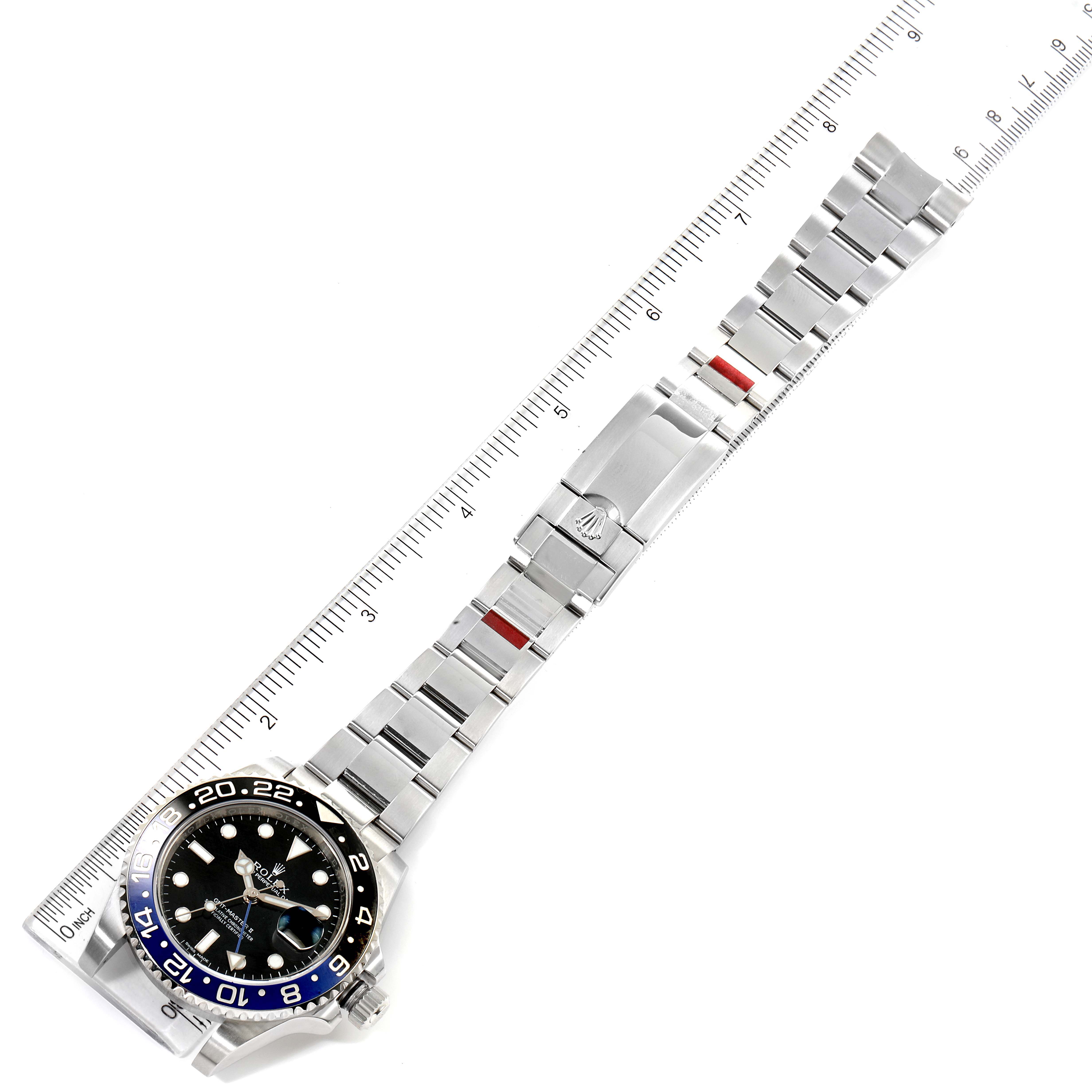 The image shows an overhead view of the Rolex GMT-Master 116710 Men's Stainless Steel Black Dial 116710 Men's Stainless Steel Black Dial watch, including its face, bezel, and extended stainless steel bracelet.