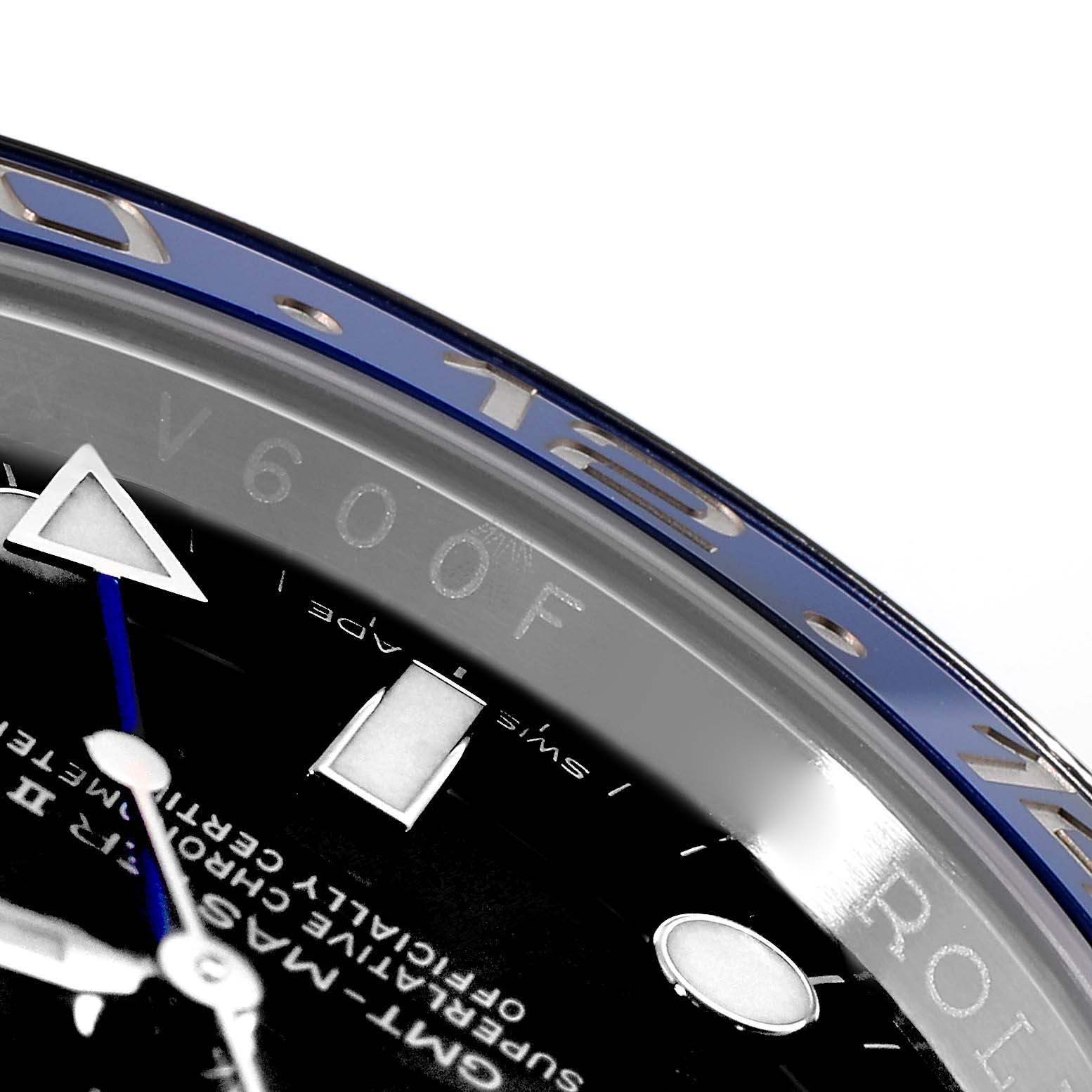 This image shows a close-up of the bezel, part of the face, and hour markers of a Rolex GMT-Master 116710 Men's Stainless Steel Black Dial 116710 Men's Stainless Steel Black Dial watch.