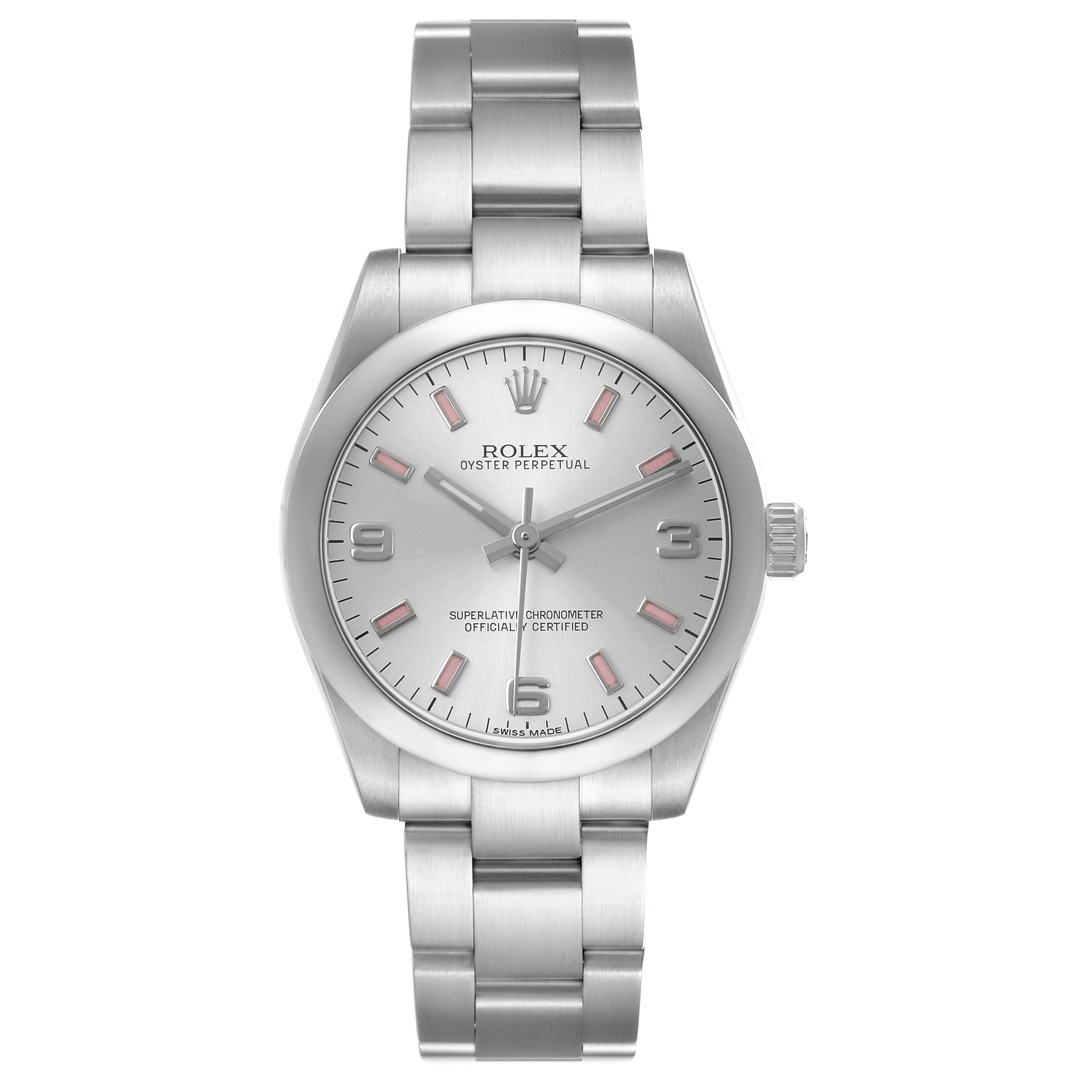 The Rolex Oyster Perpetual Mid-Size watch is shown from a front angle, displaying the dial, bracelet, and crown.