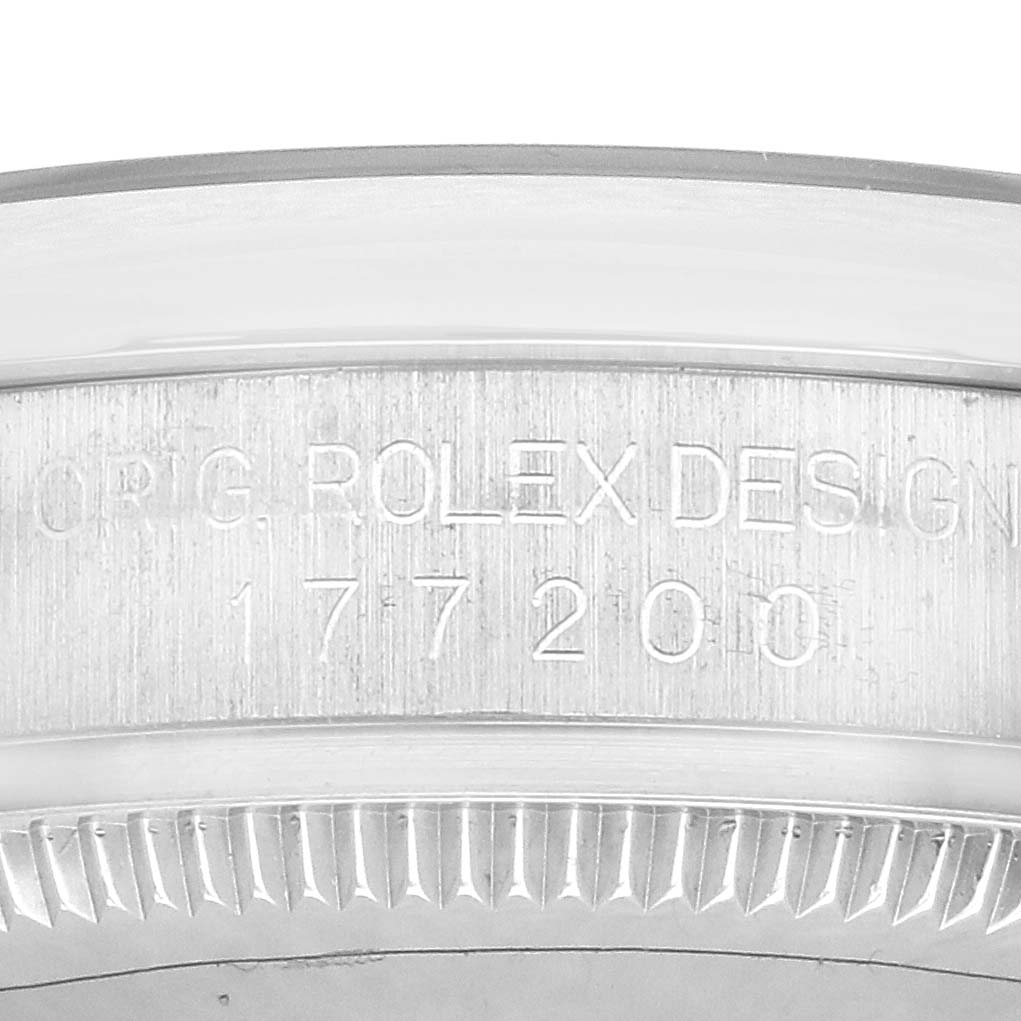 The image shows the case side of the Mid-Size Rolex watch with engravings of the model and brand name.